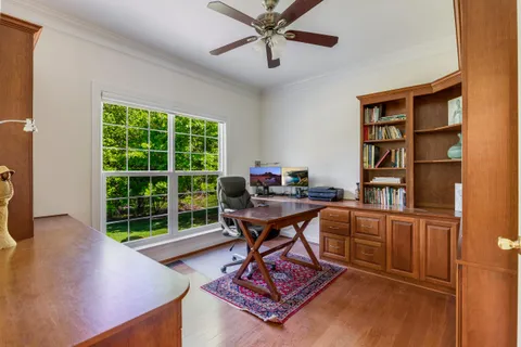 a work room with furniture and a window