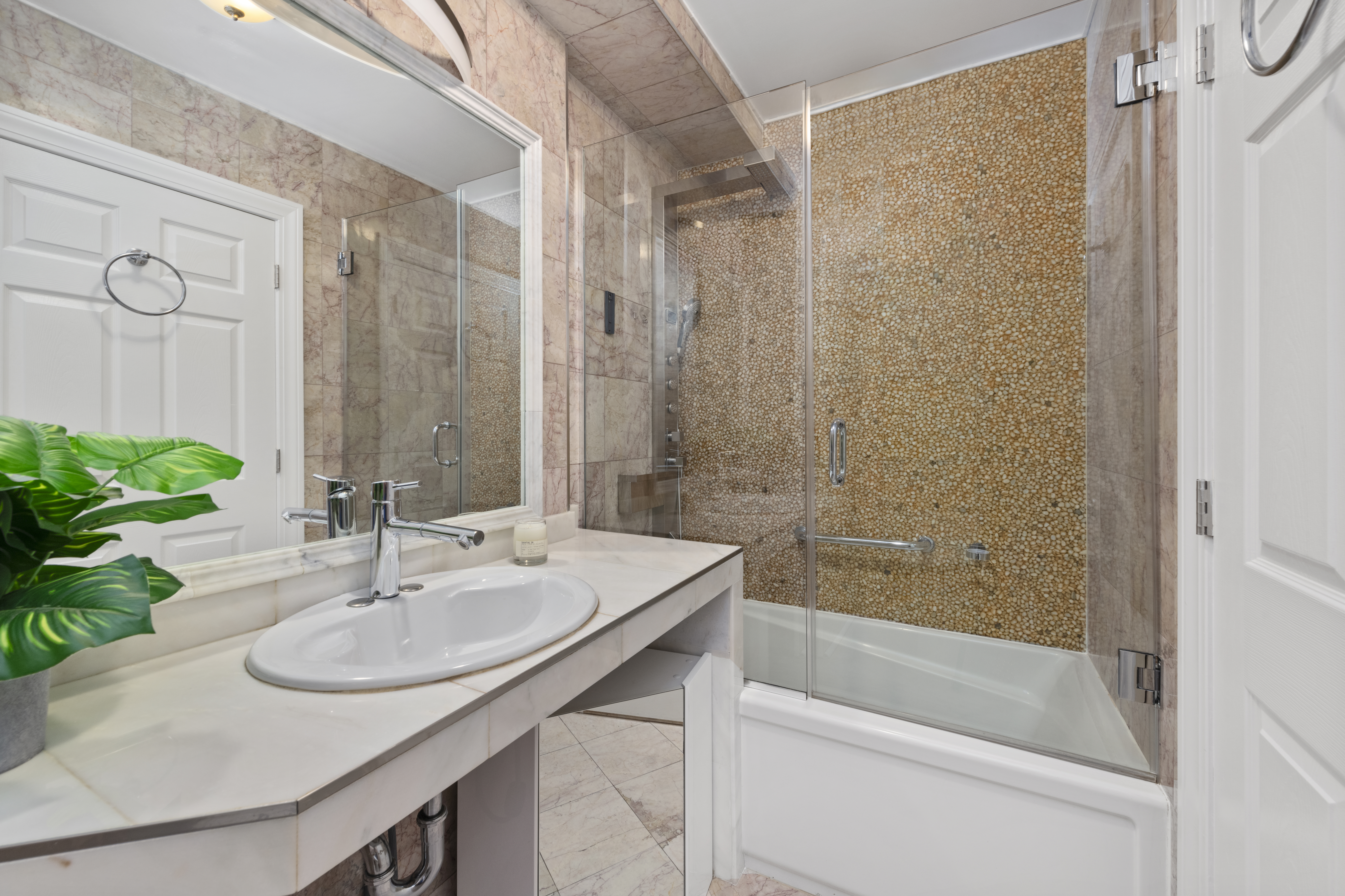 195 East 76th Street Manhattan, NY 10021 - Photo 13 of 20 a bathroom with a sink and a mirror