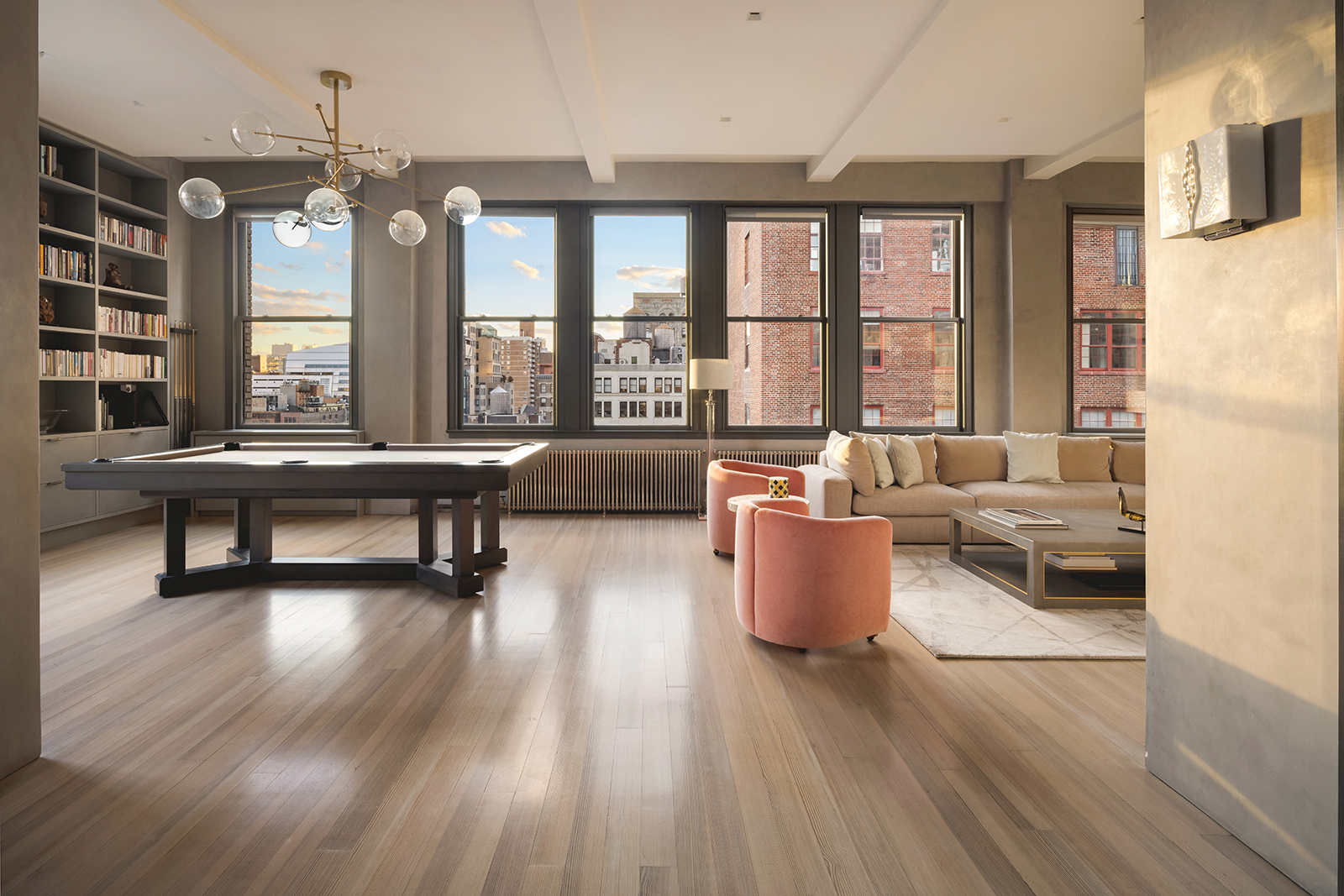 105 East 29th Street, Unit 12PH Manhattan, NY 10016 - Photo 3 of 24 a living room with furniture and a large window