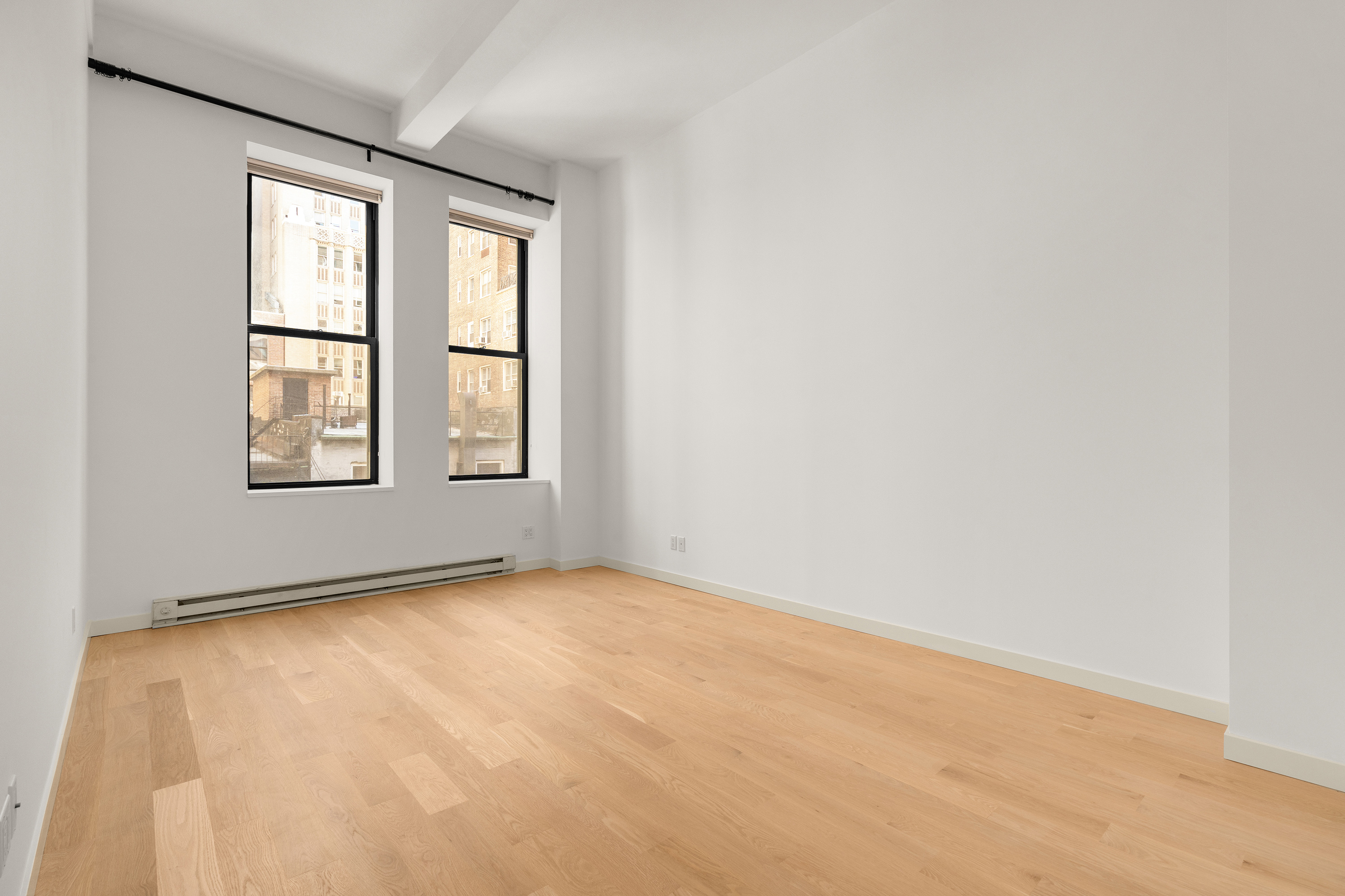 11 East 36th Street, Unit 503 Manhattan, NY 10016 - Photo 2 of 17 an empty room with windows