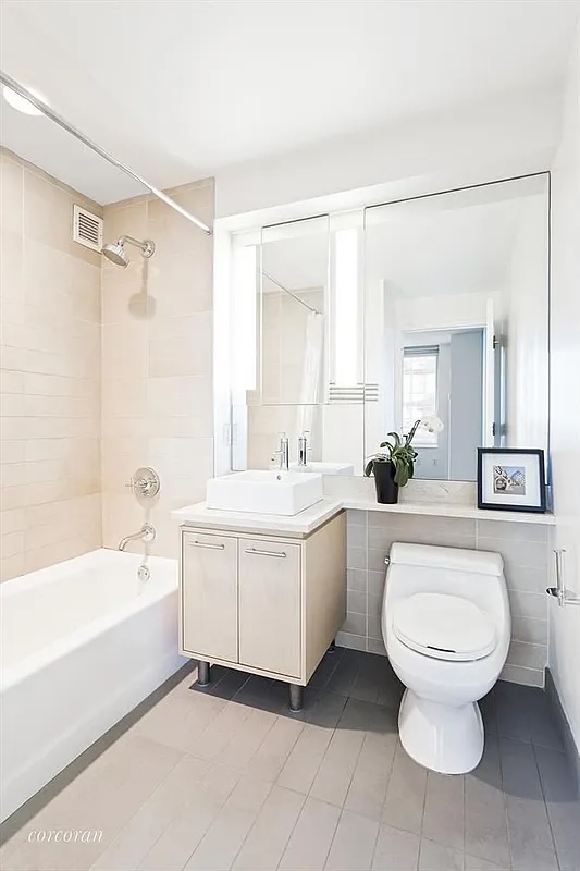 306 Gold Street, Unit 22B Brooklyn, NY 11201 - Photo 4 of 11 a bathroom with a sink toilet and shower