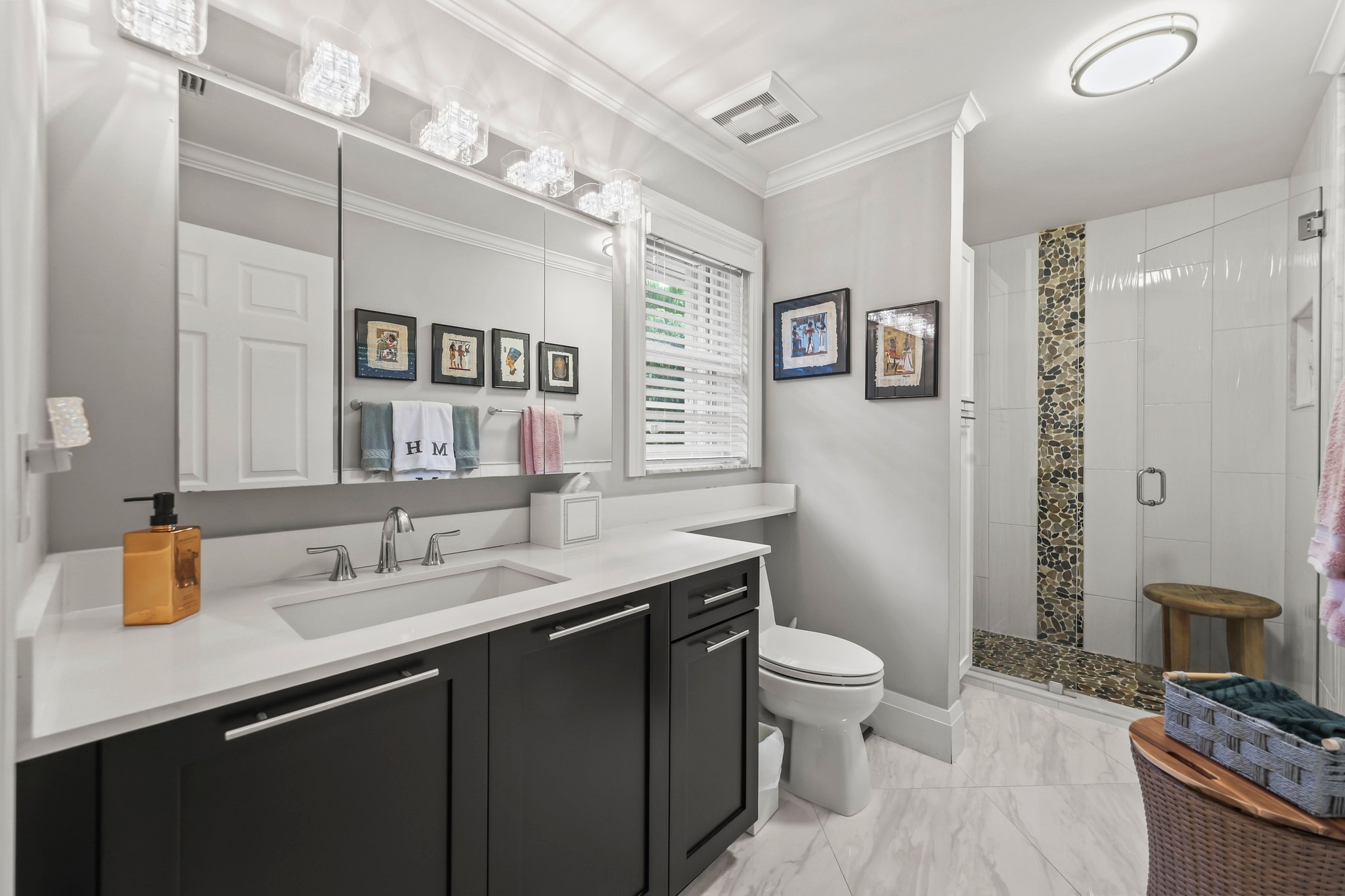 20317 Hacienda Court Boca Raton, FL 33498 - Photo 38 of 100 a bathroom with a granite countertop sink a toilet a mirror and shower