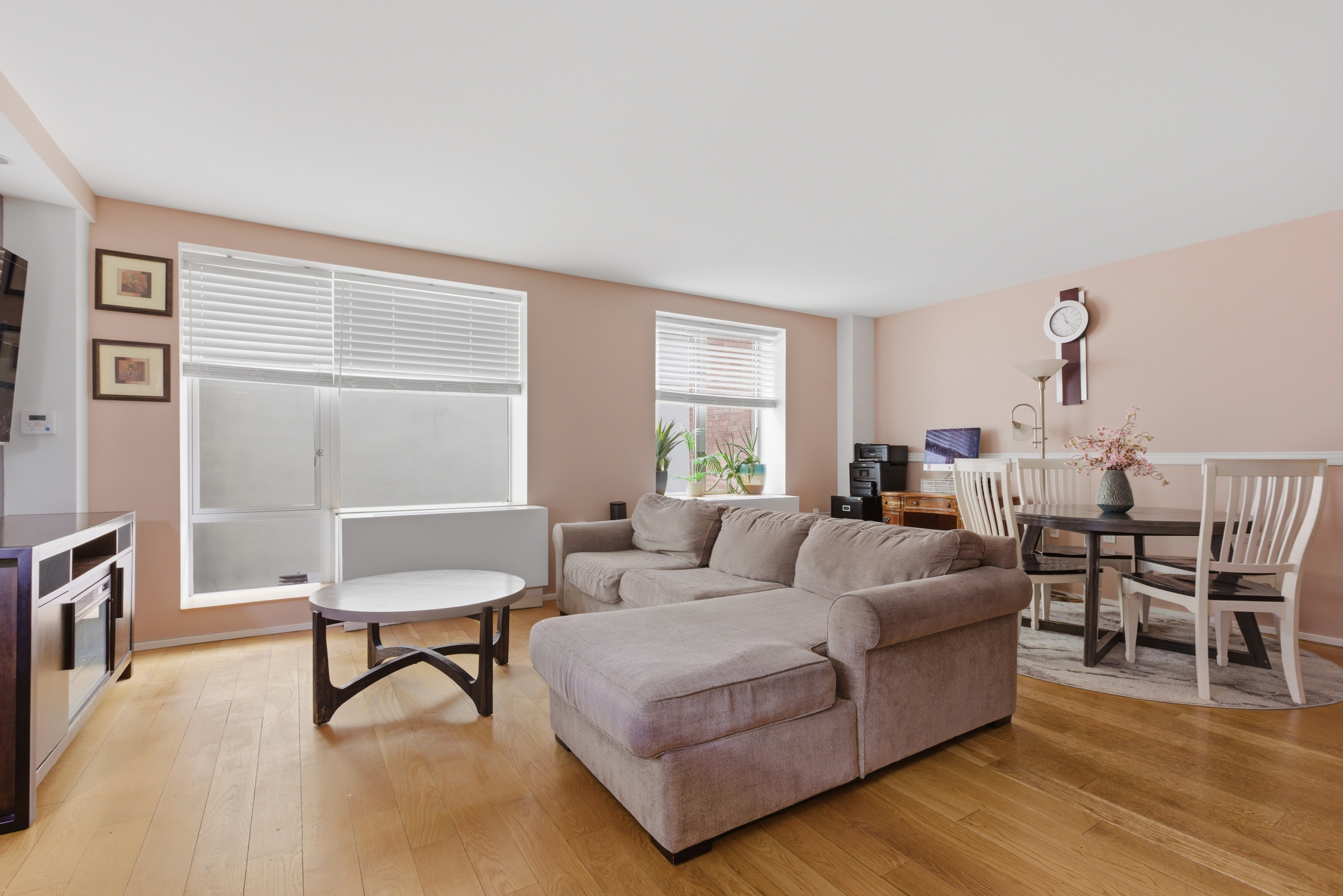 2280 Frederick Douglass Boulevard Manhattan, NY 10027 - Photo 3 of 10 a living room with furniture and a wooden floor