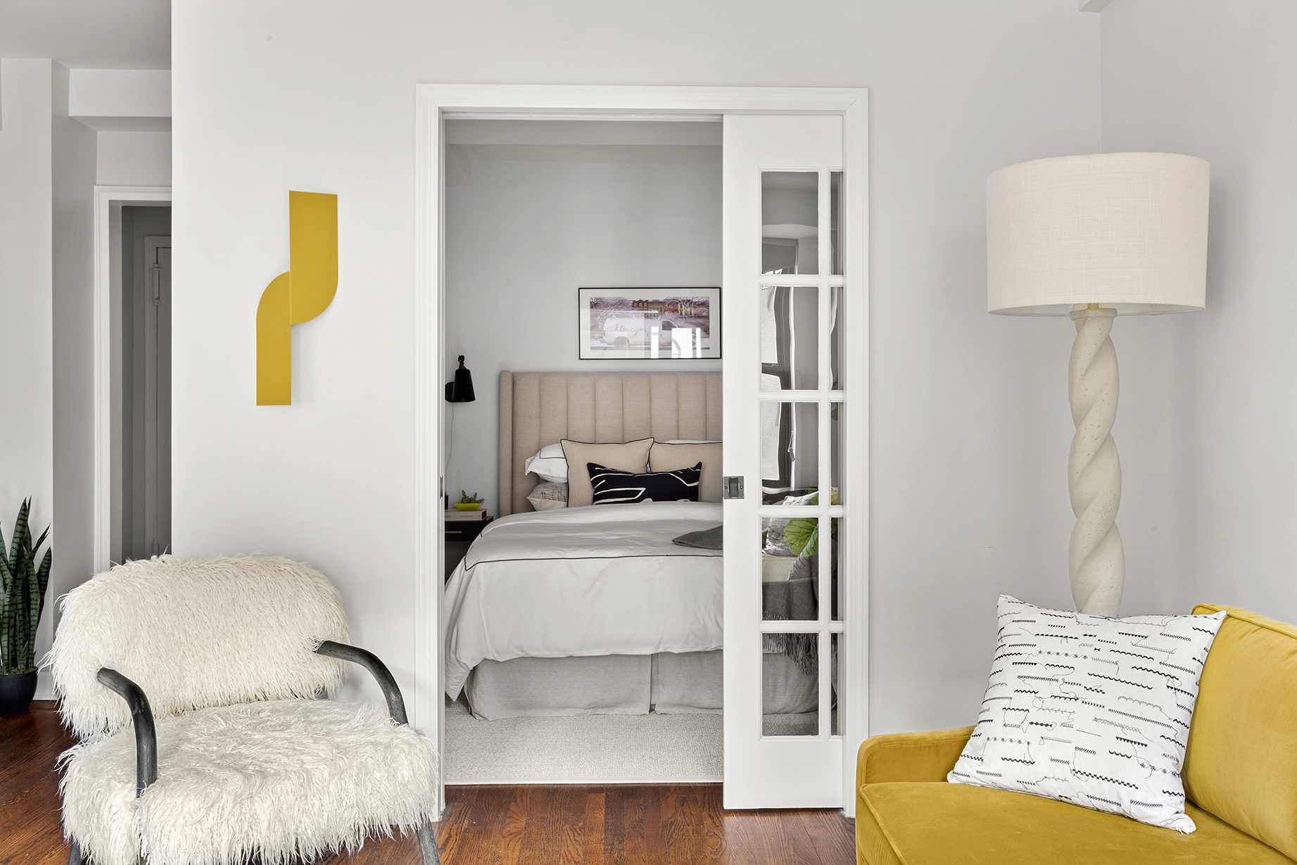 161 West 16th Street, Unit 6E Manhattan, NY 10011 - Photo 7 of 15 a bedroom with a bed and a couch