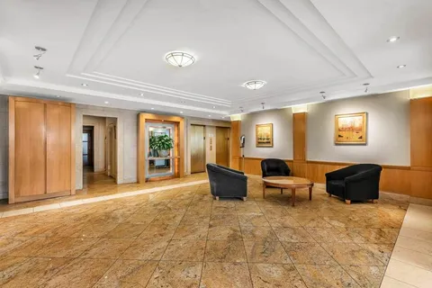 a living room with furniture window and wooden floor