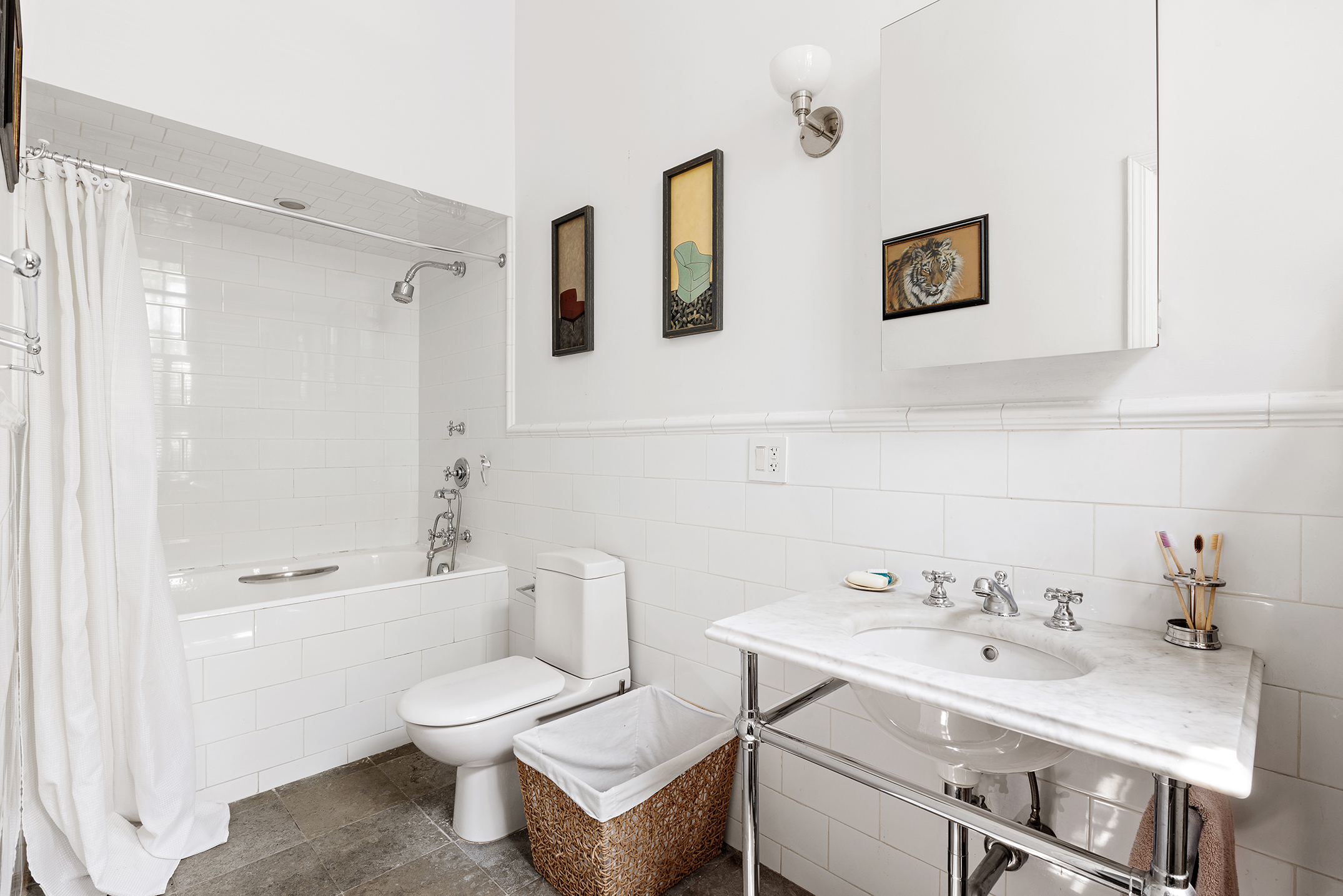 159 East 63rd Street, Unit 2/3 Manhattan, NY 10065 - Photo 8 of 13 a bathroom with a sink a toilet and shower