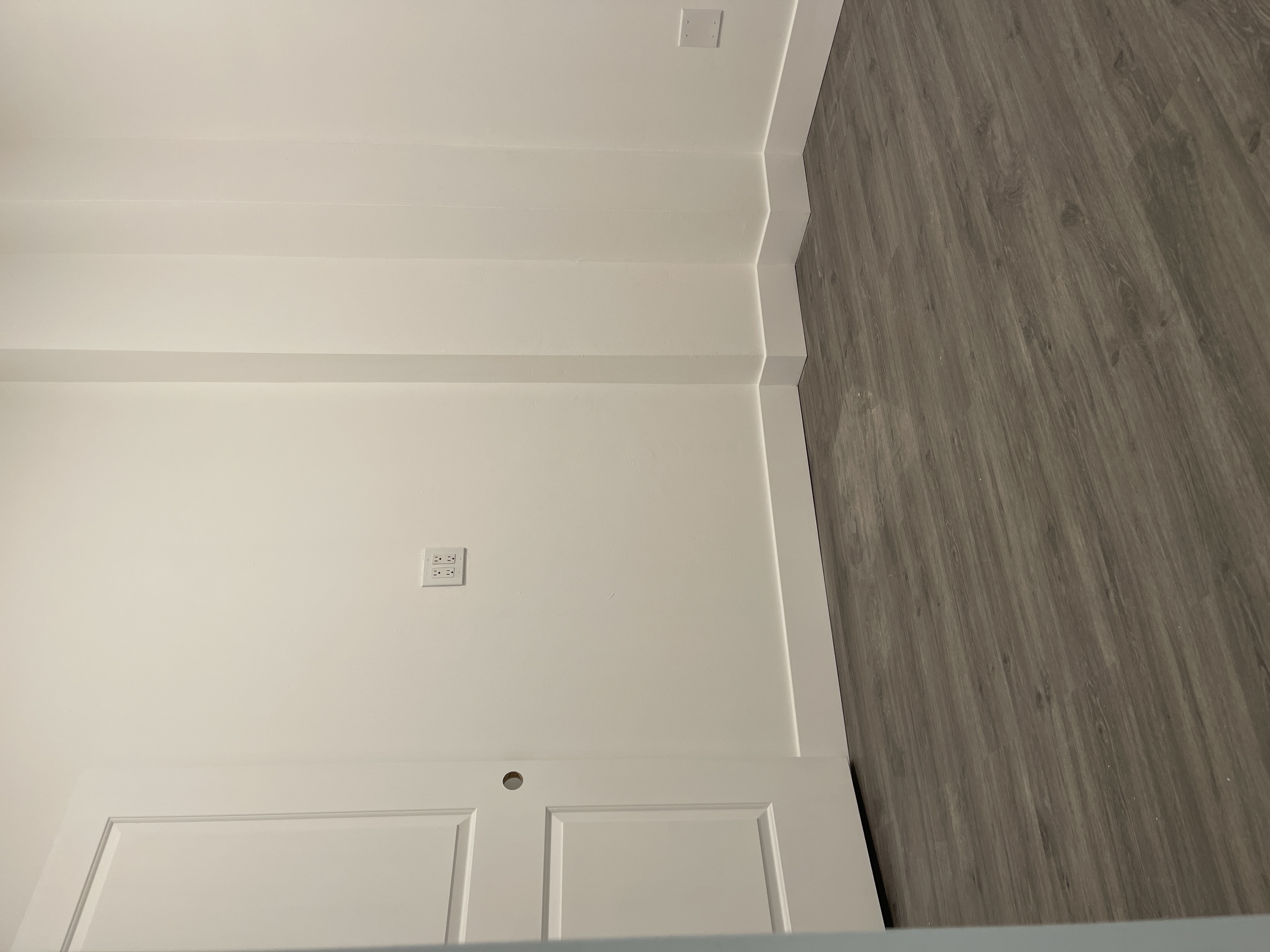 1999 3rd Avenue, Unit 1 Manhattan, NY 10029 - Photo 6 of 23 a view of an empty room with wooden floor