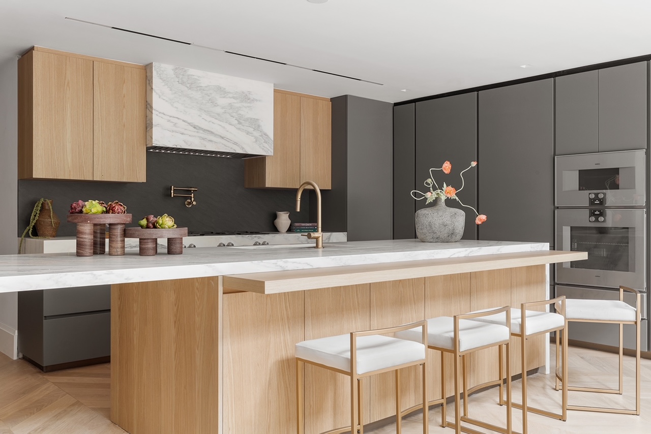 17 East 9th Street Manhattan, NY 10003 - Photo 9 of 32 a kitchen with stainless steel appliances a sink and cabinets