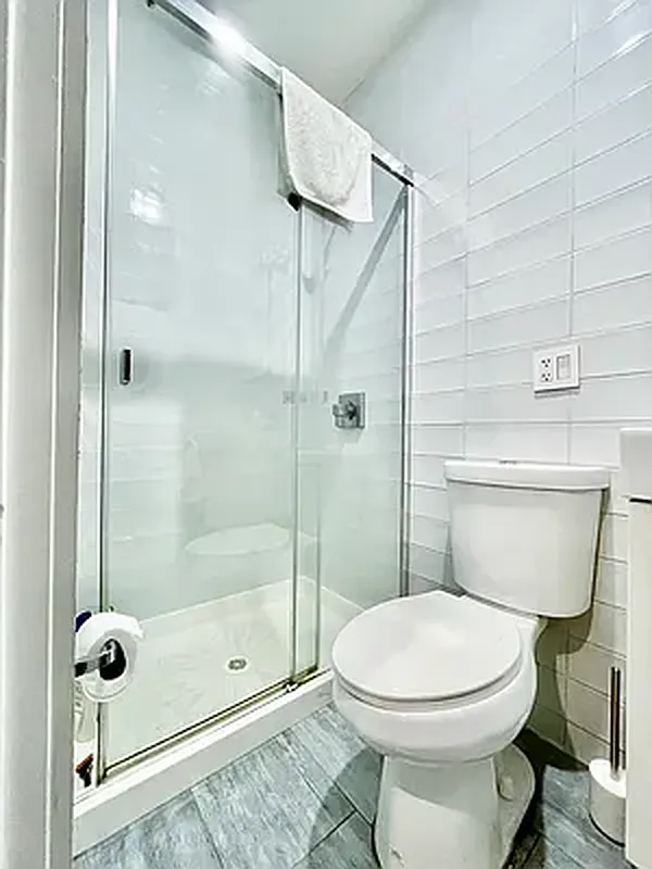 57 Spring Street, Unit 2 Manhattan, NY 10012 - Photo 5 of 5 a bathroom with a toilet and shower