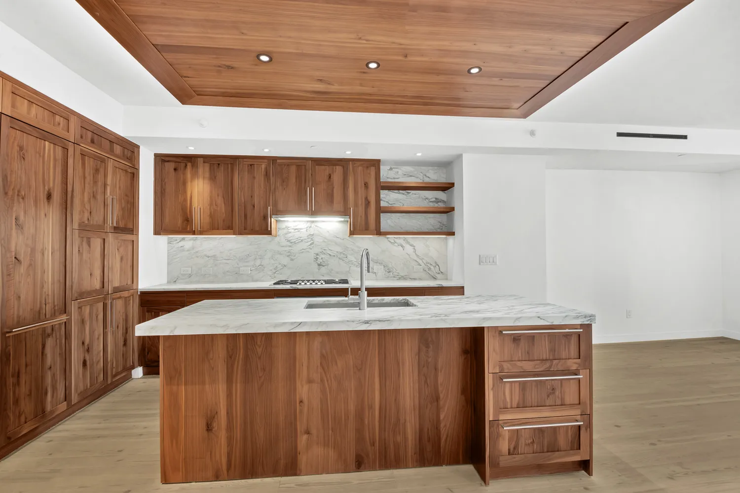 an empty room with large windows