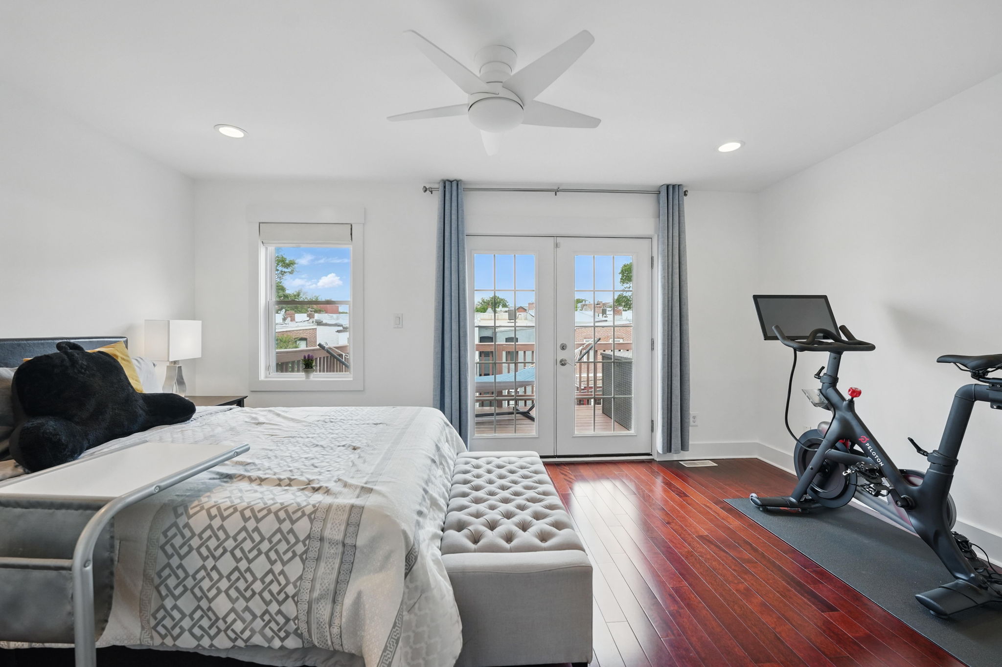 28 Q Street Northeast, Unit 2 Washington, DC 20002 - Photo 31 of 41 a bedroom with a bed gym equipment and a view of living room