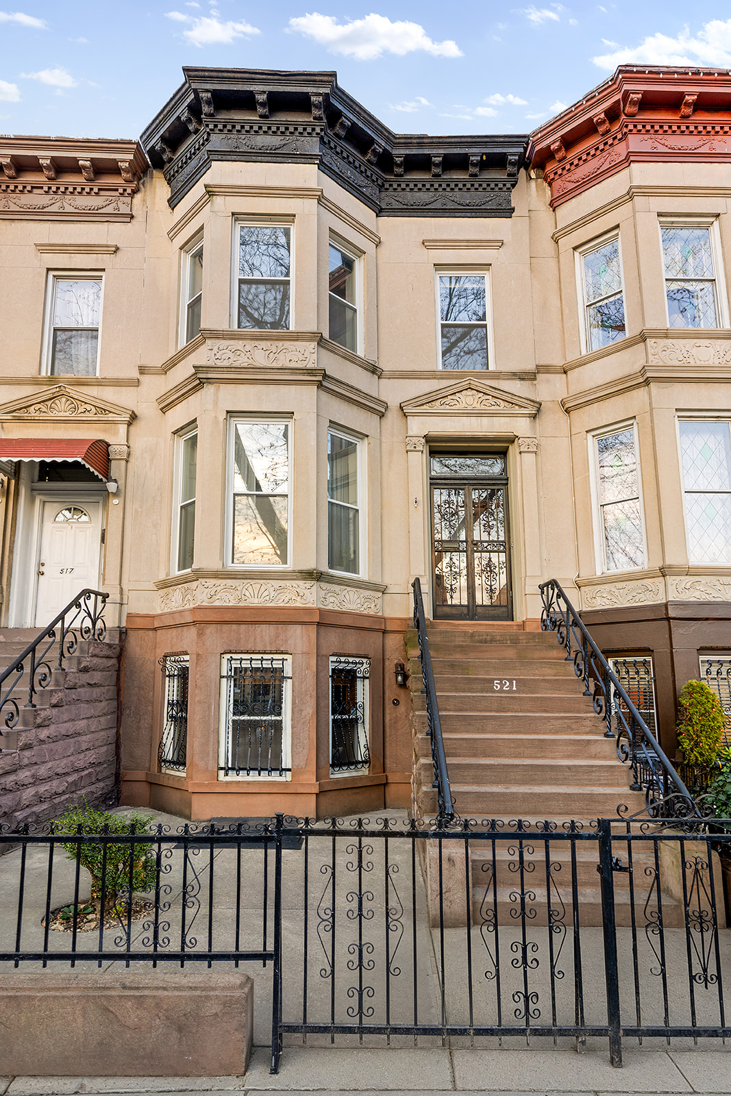 521 84th Street Brooklyn, NY 11209 - Photo 17 of 19 a front view of a residential apartment building with a yard