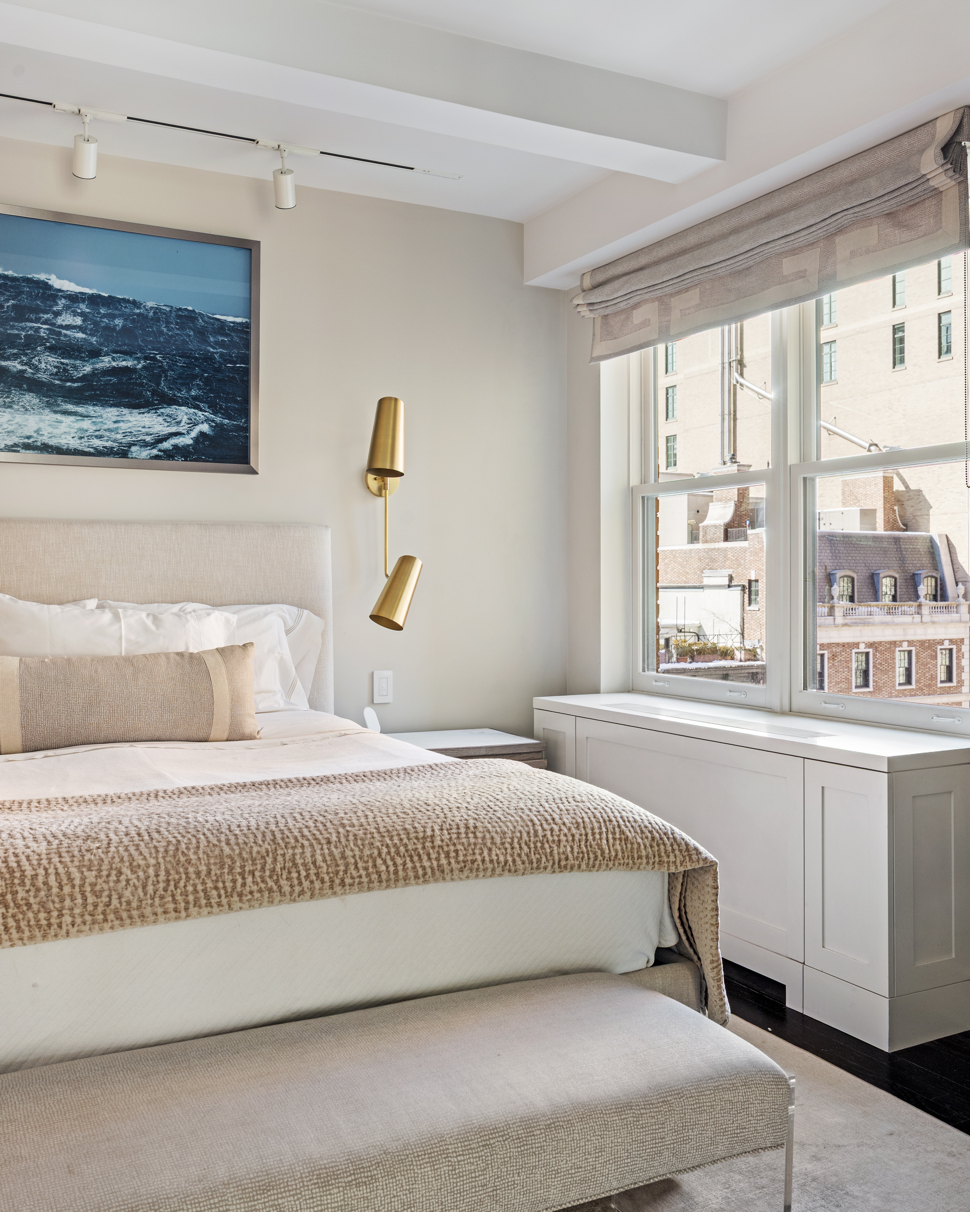 169 East 78th Street, Unit 7C Manhattan, NY 10075 - Photo 20 of 30 a bedroom with a large bed and a large window