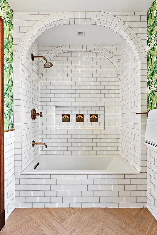 115 Allen Street, Unit 3 Manhattan, NY 10002 - Photo 11 of 13 a bathroom with a bathtub and shower