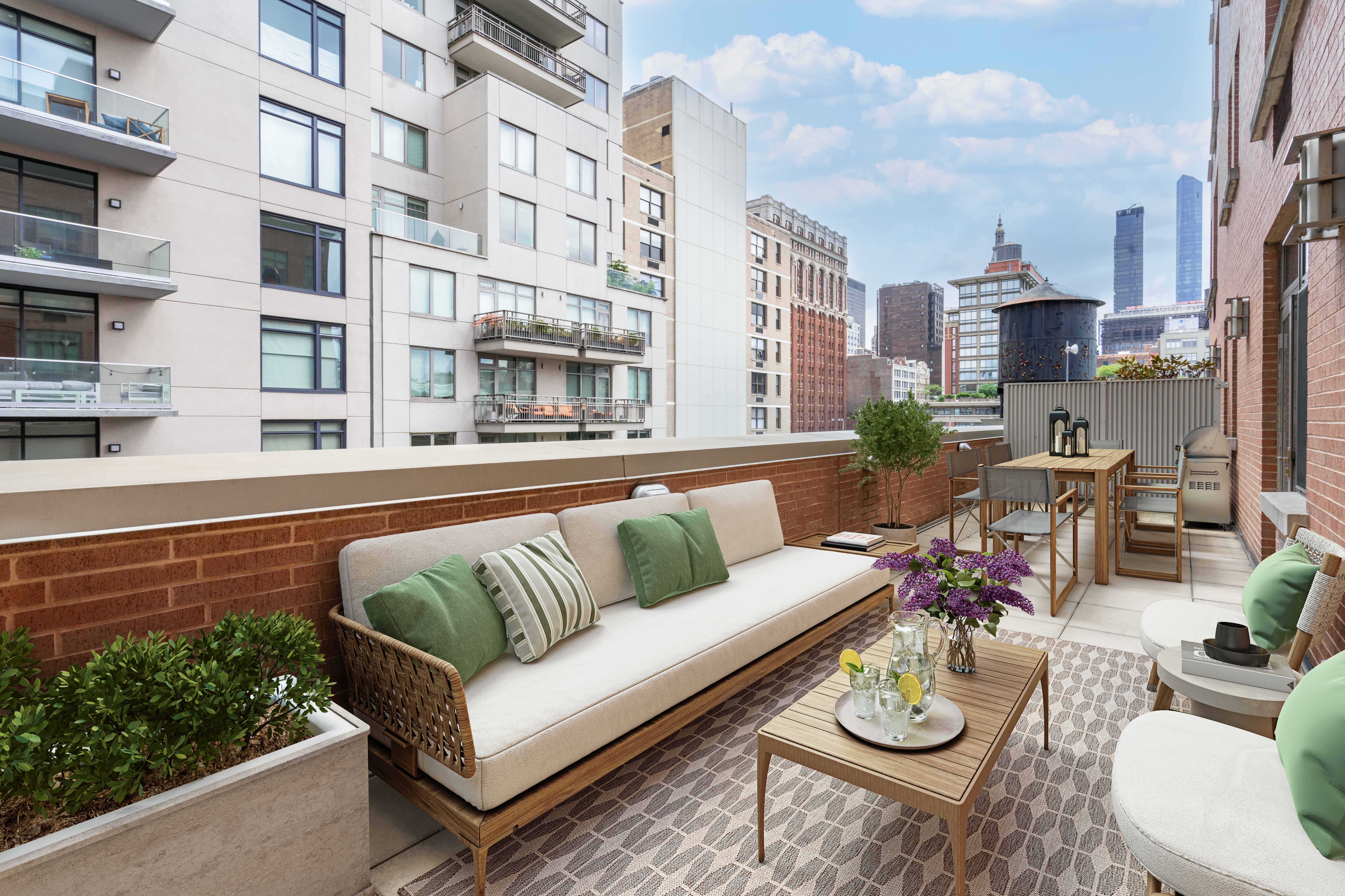 125 West 22nd Street, Unit 10A Manhattan, NY 10011 - Photo 1 of 11 a view of a patio with couches table and chairs and potted plants