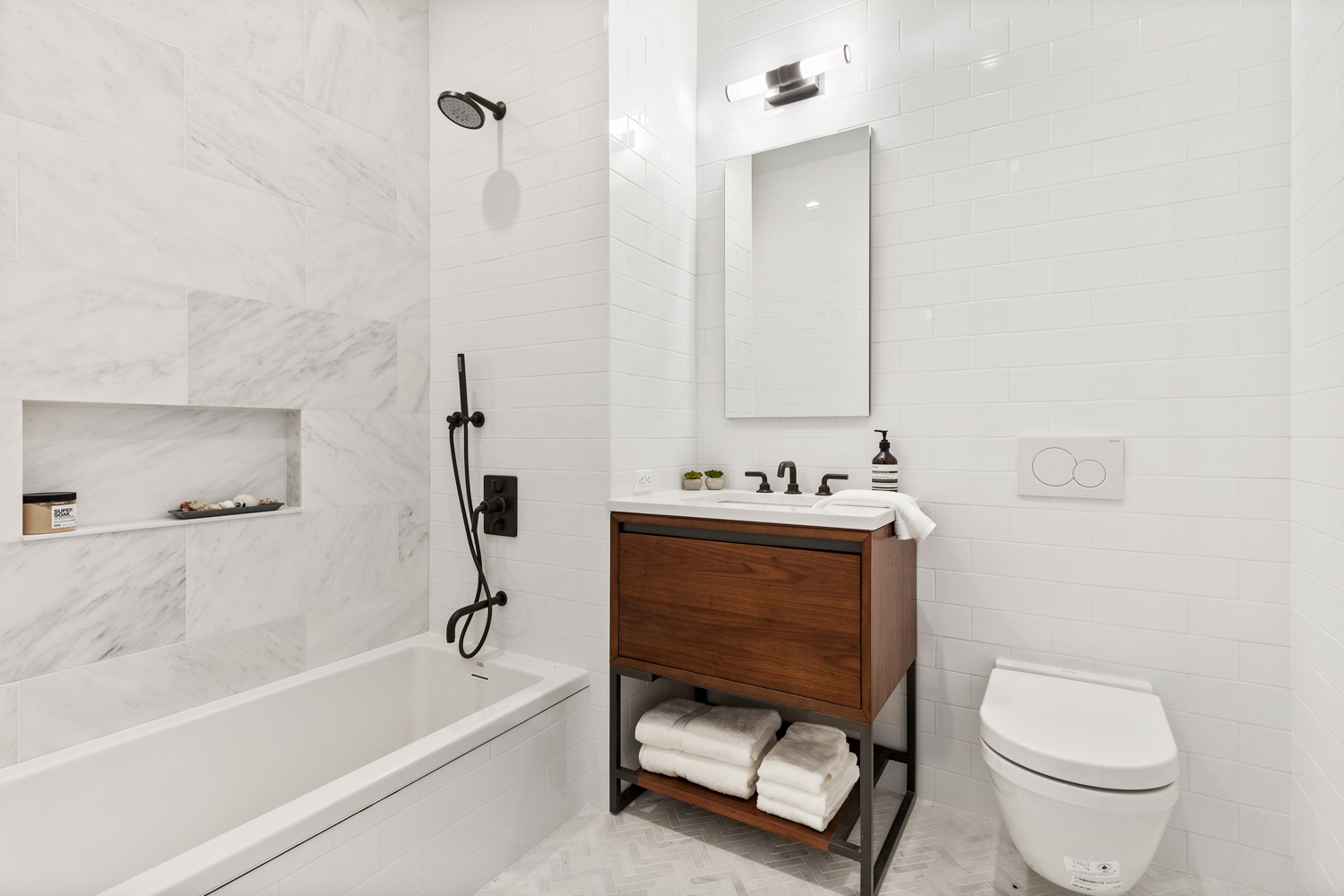 243 North 5th Street, Unit 2B Brooklyn, NY 11211 - Photo 11 of 14 a bathroom with a sink toilet and bathtub