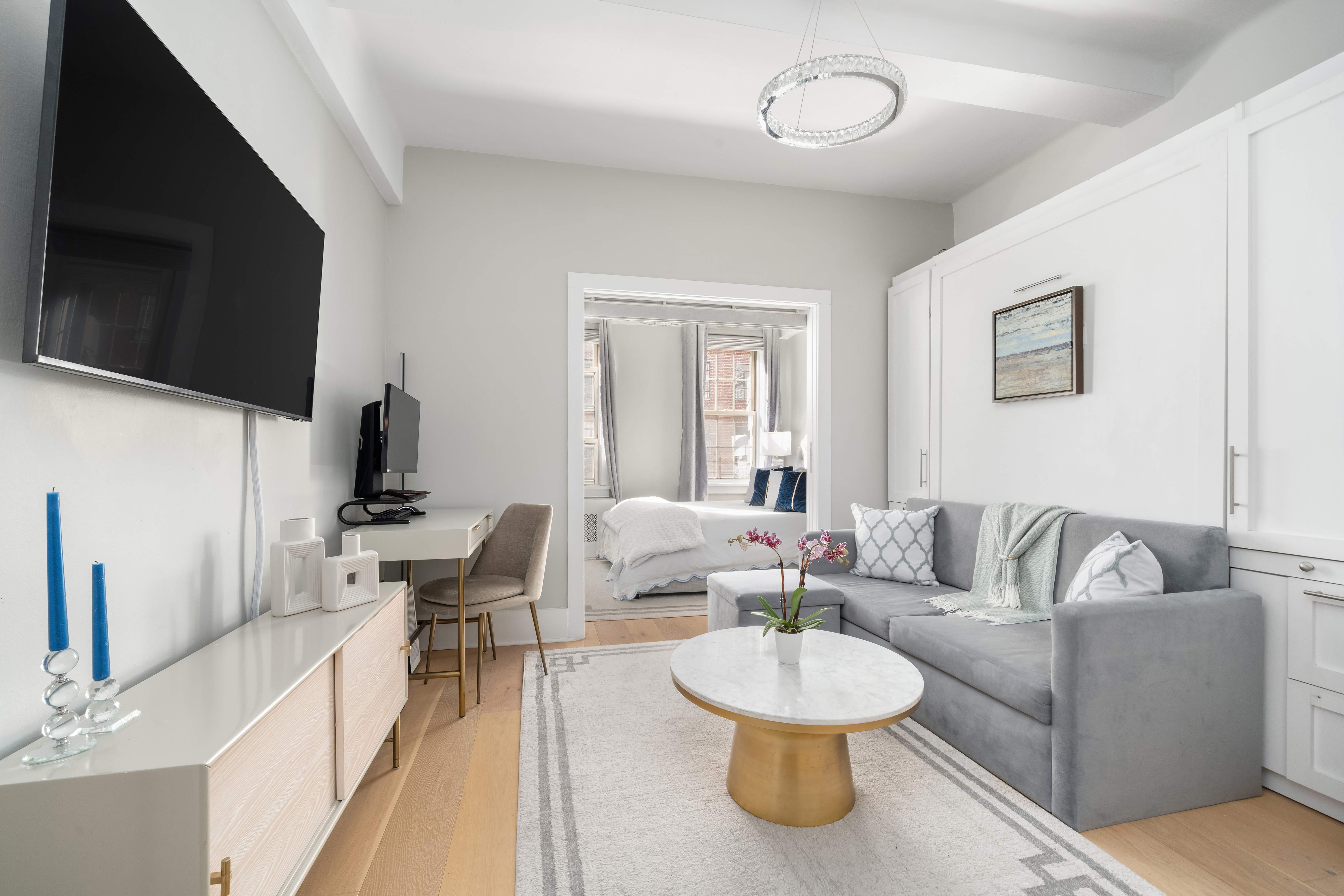 a living room with furniture and a flat screen tv