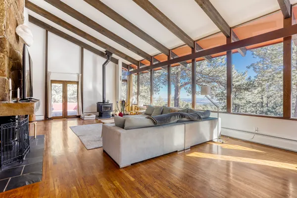 a living room with furniture a fireplace and a table