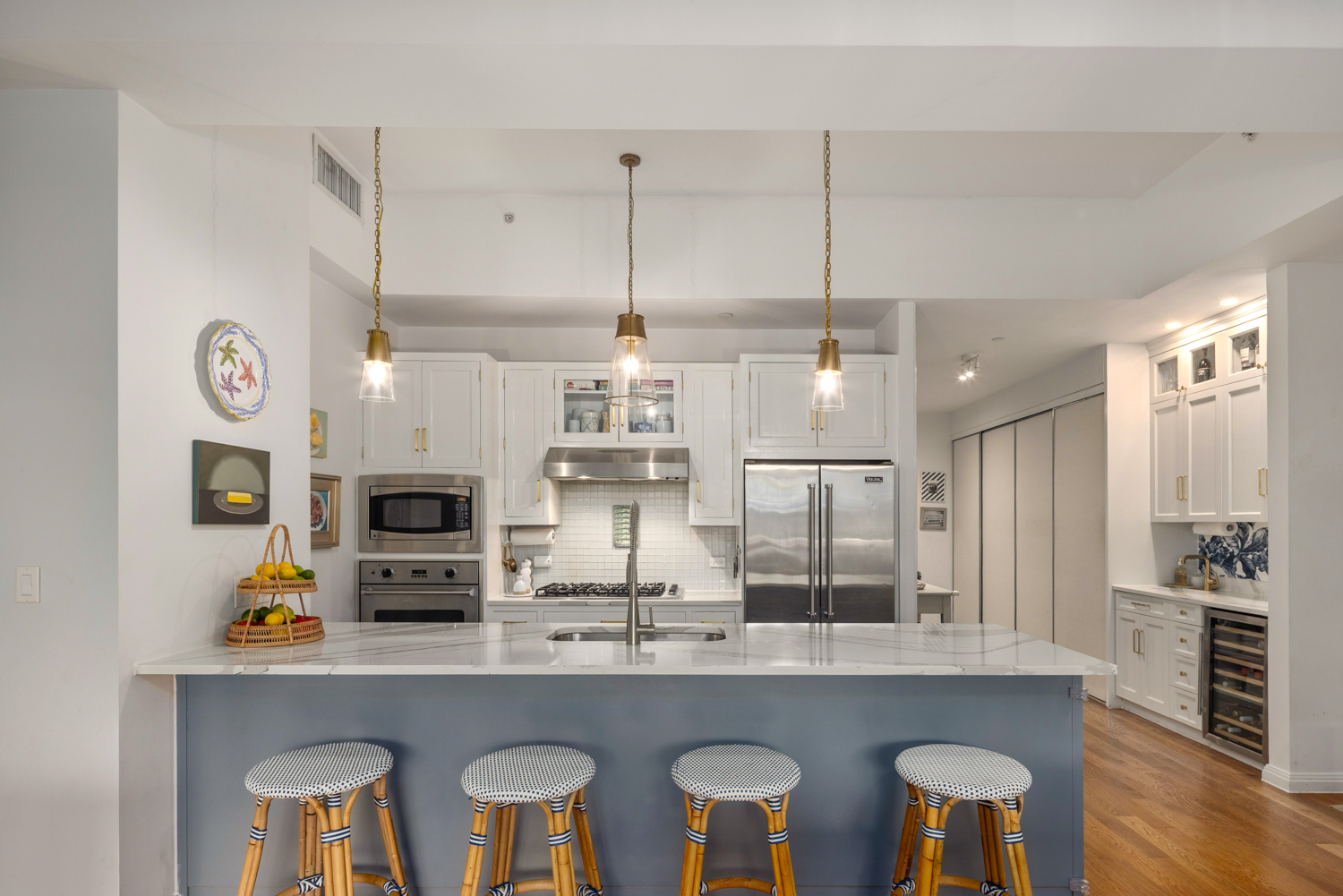 9 College Place, Unit 3A Brooklyn, NY 11201 - Photo 3 of 13 a kitchen with stainless steel appliances a sink a stove a refrigerator cabinets and chairs