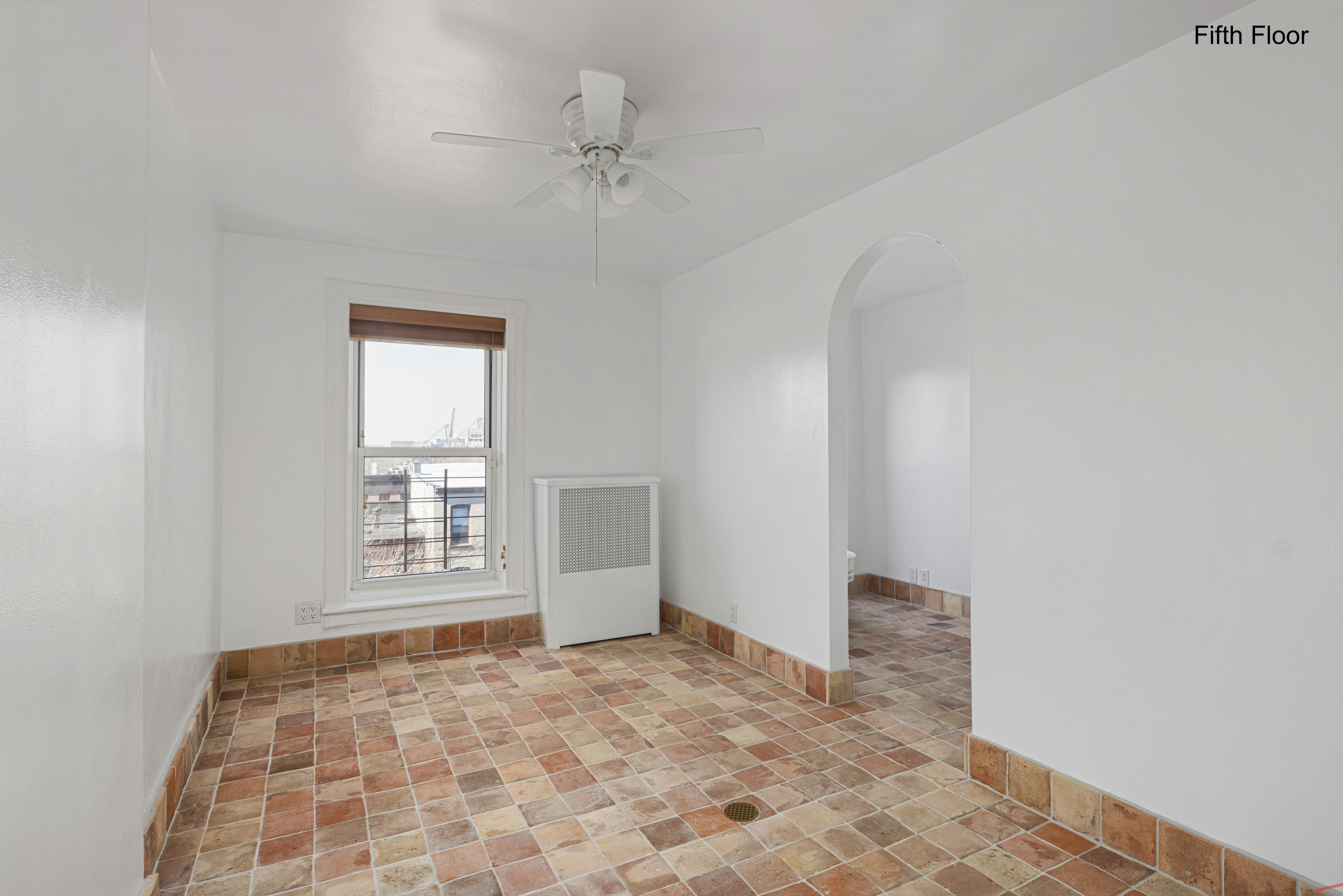20 Strong Place Brooklyn, NY 11231 - Photo 16 of 21 a view of empty room with a window and fireplace