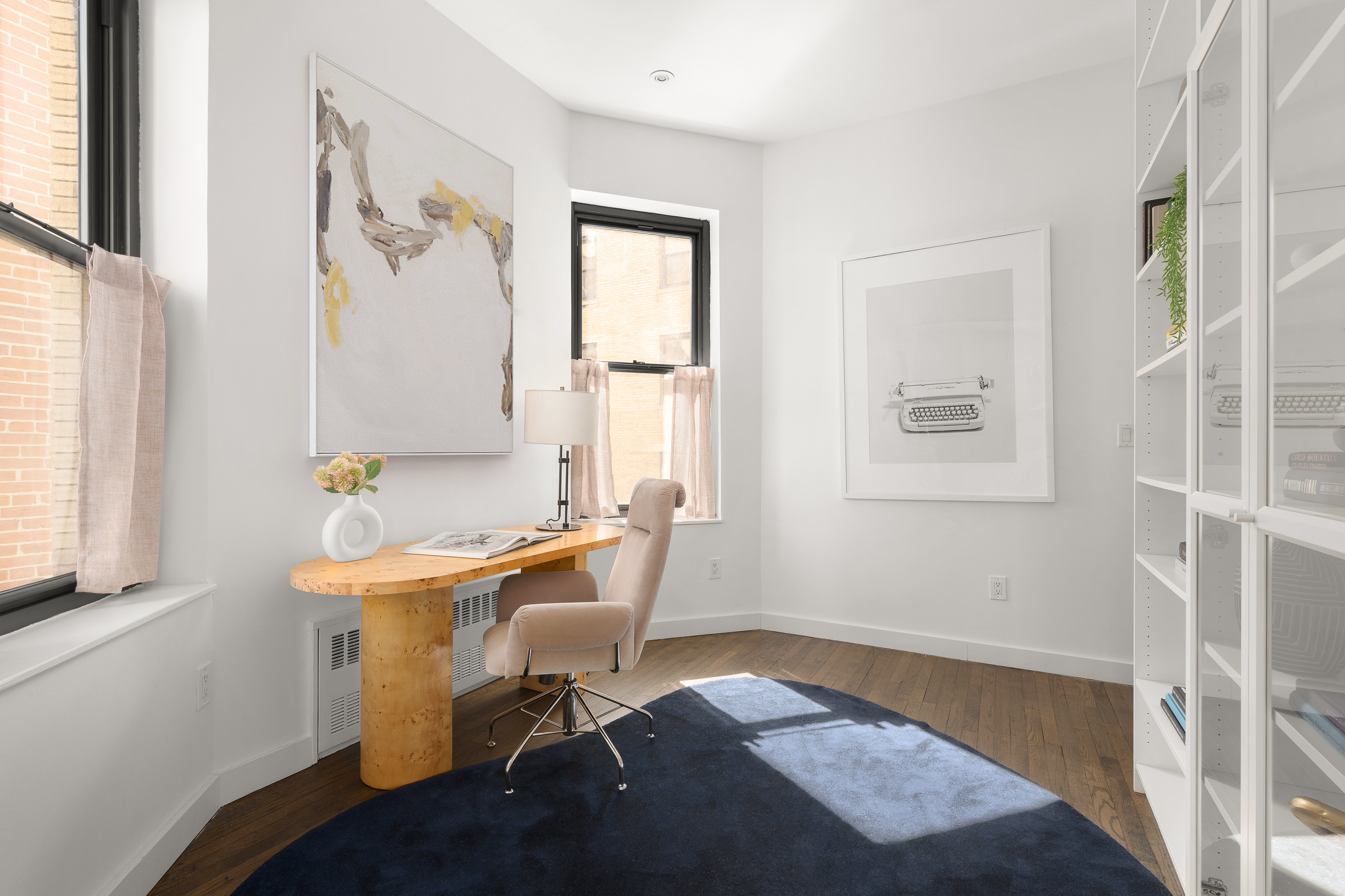 342 West 85th Street, Unit PH6AB Manhattan, NY 10024 - Photo 10 of 17 a workspace with wooden floor and a window