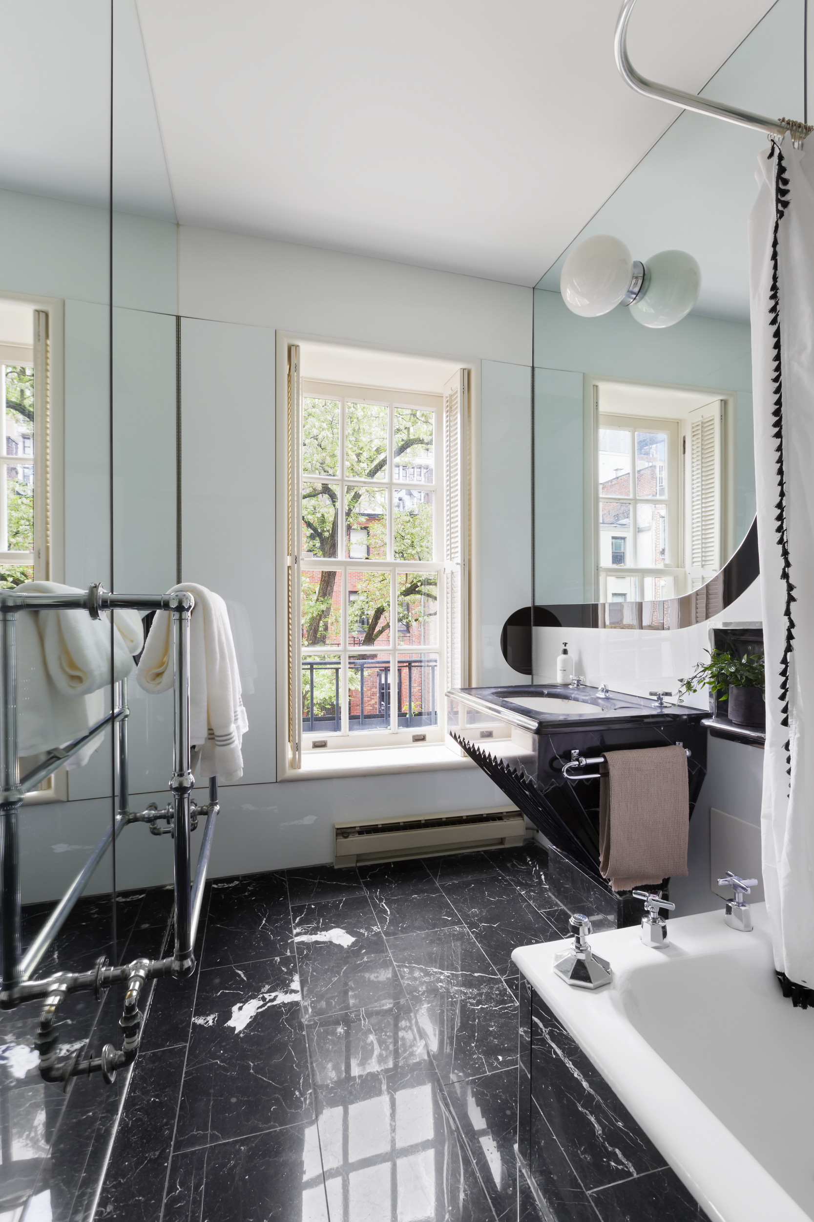 37 West 70th Street Manhattan, NY 10023 - Photo 32 of 41 a room with a large window and table