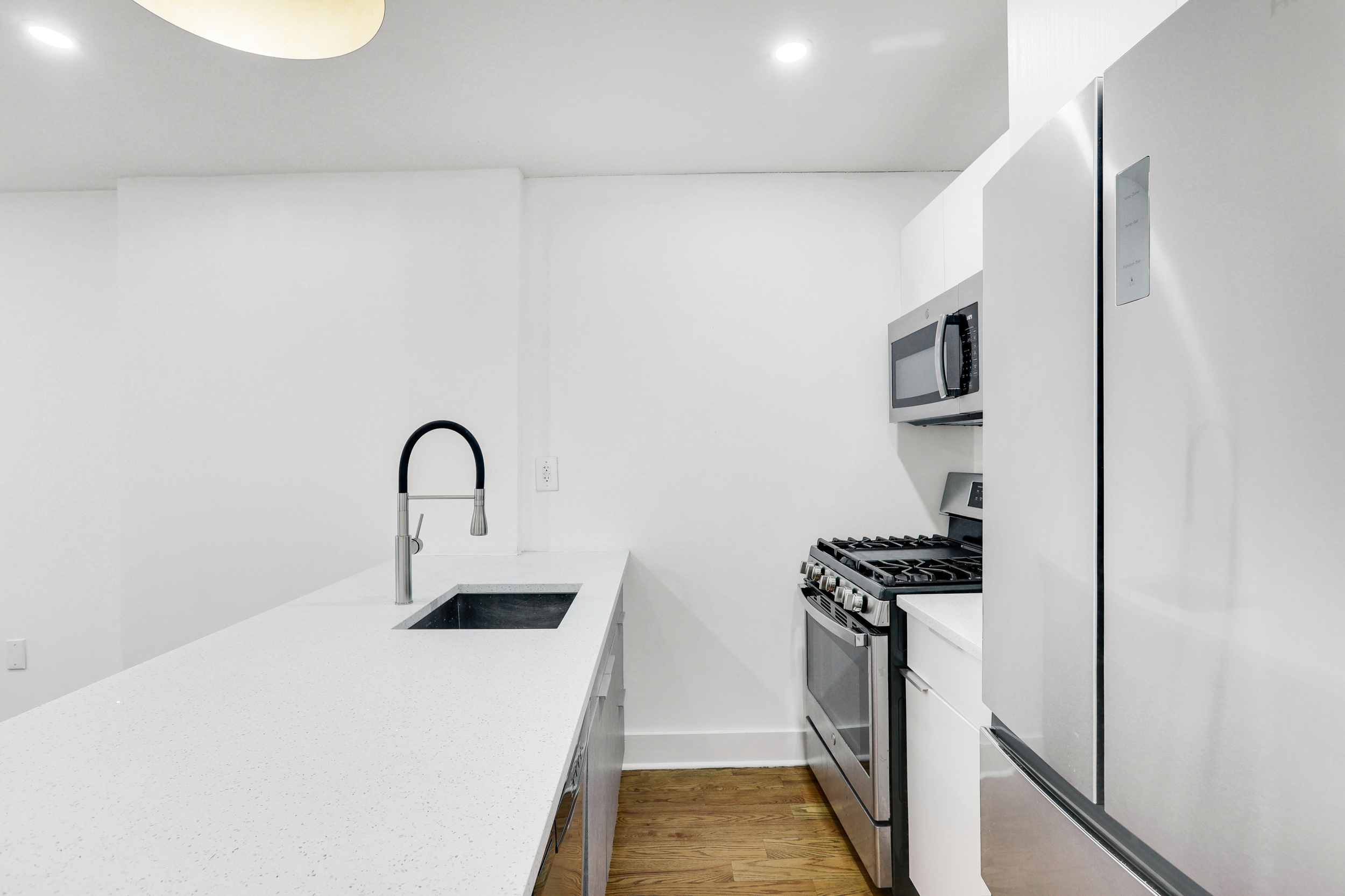 846 Hancock Street, Unit GARDEN Brooklyn, NY 11233 - Photo 3 of 17 a kitchen with a sink and a stove top oven