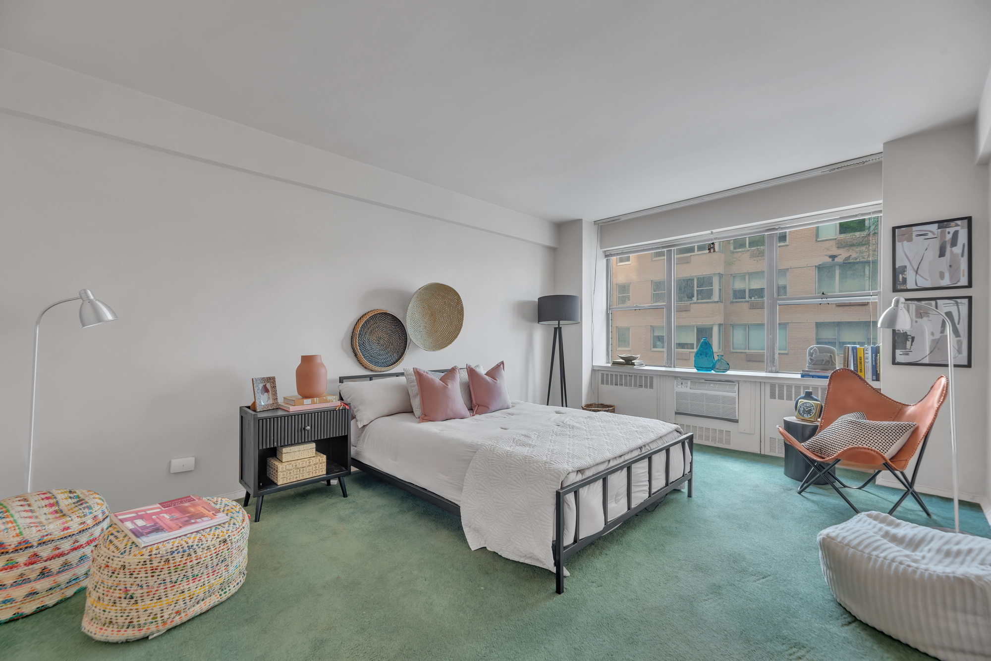 45 Sutton Place South, Unit 3D Manhattan, NY 10022 - Photo 8 of 16 a bedroom with a bed chair and window