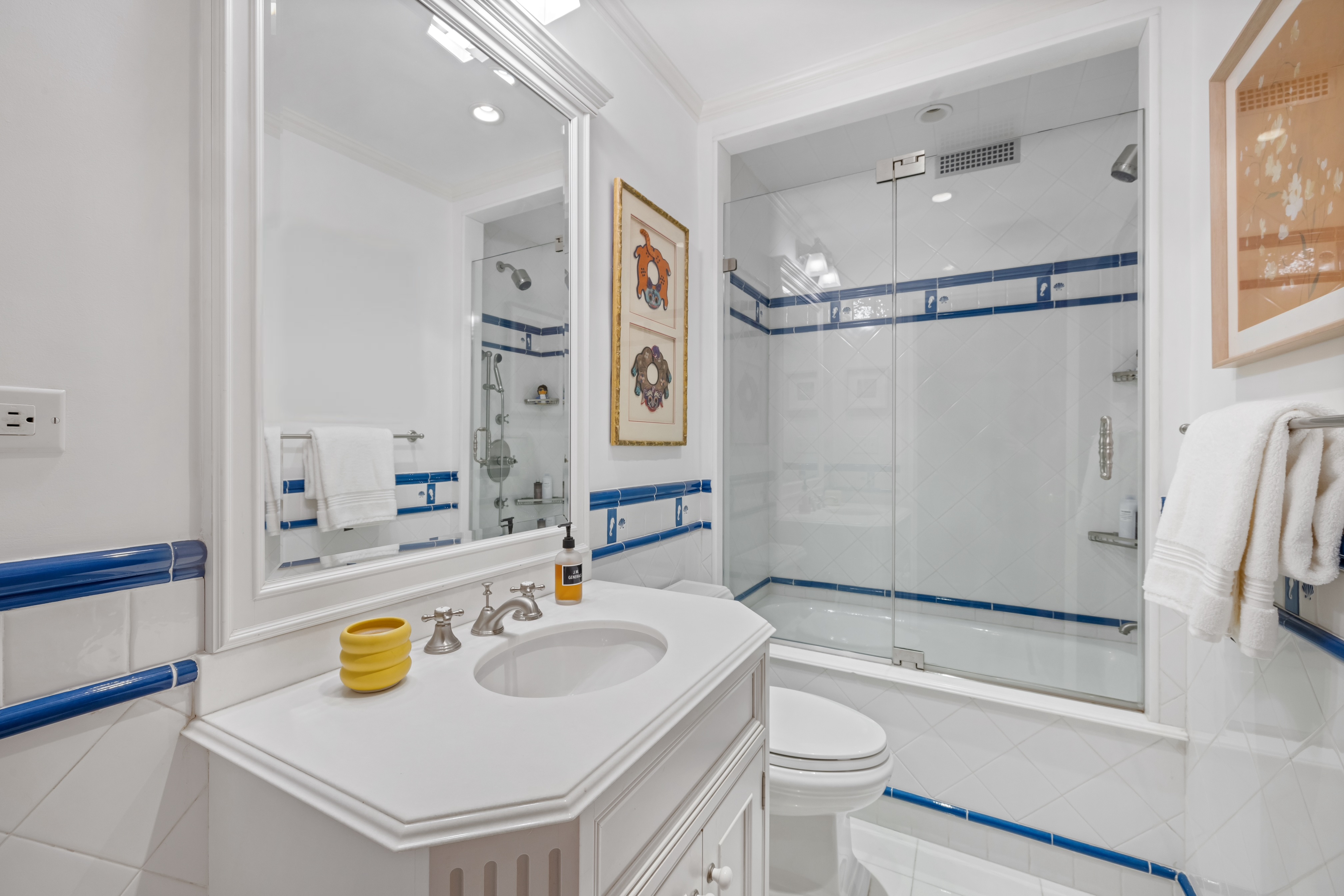 320 East 72nd Street, Unit 5B Manhattan, NY 10021 - Photo 15 of 18 a bathroom with a sink toilet and shower