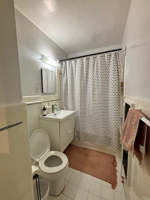319 East 50th Street, Unit 10L Manhattan, NY 10022 - Photo 7 of 11 a bathroom with a sink toilet and shower