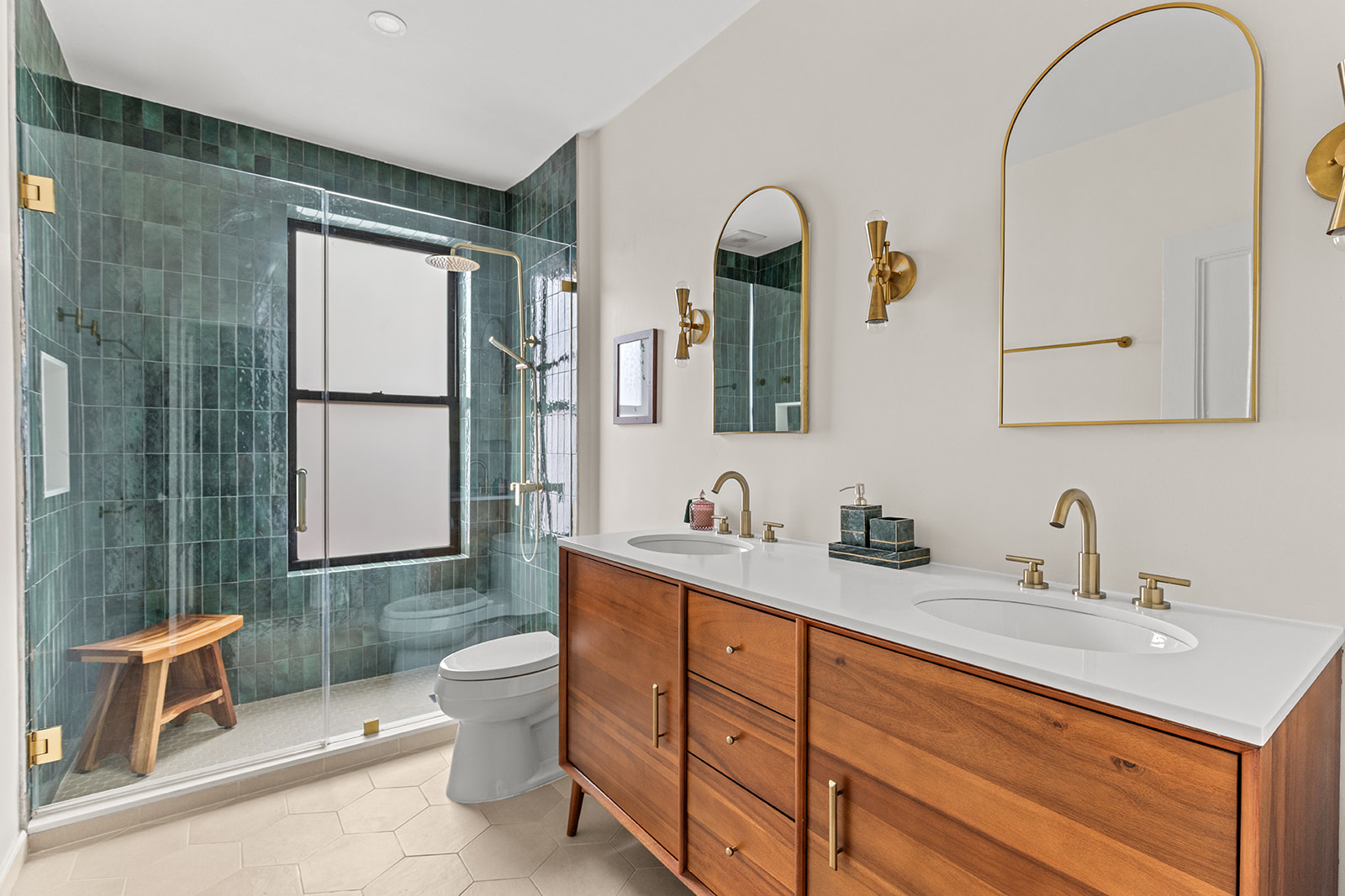 417 6th Street Brooklyn, NY 11215 - Photo 13 of 21 a bathroom with a toilet a sink a mirror and a window