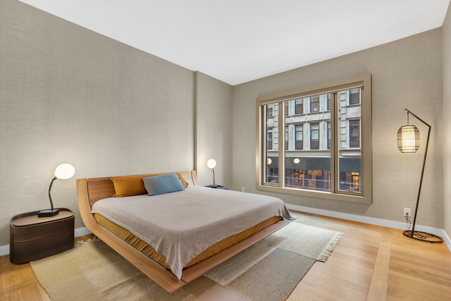 30 Warren Street, Unit 2C Manhattan, NY 10007 - Photo 6 of 18 a bedroom with a large bed and a large window