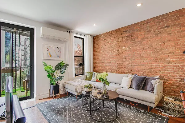 a living room with furniture plant and a potted plant