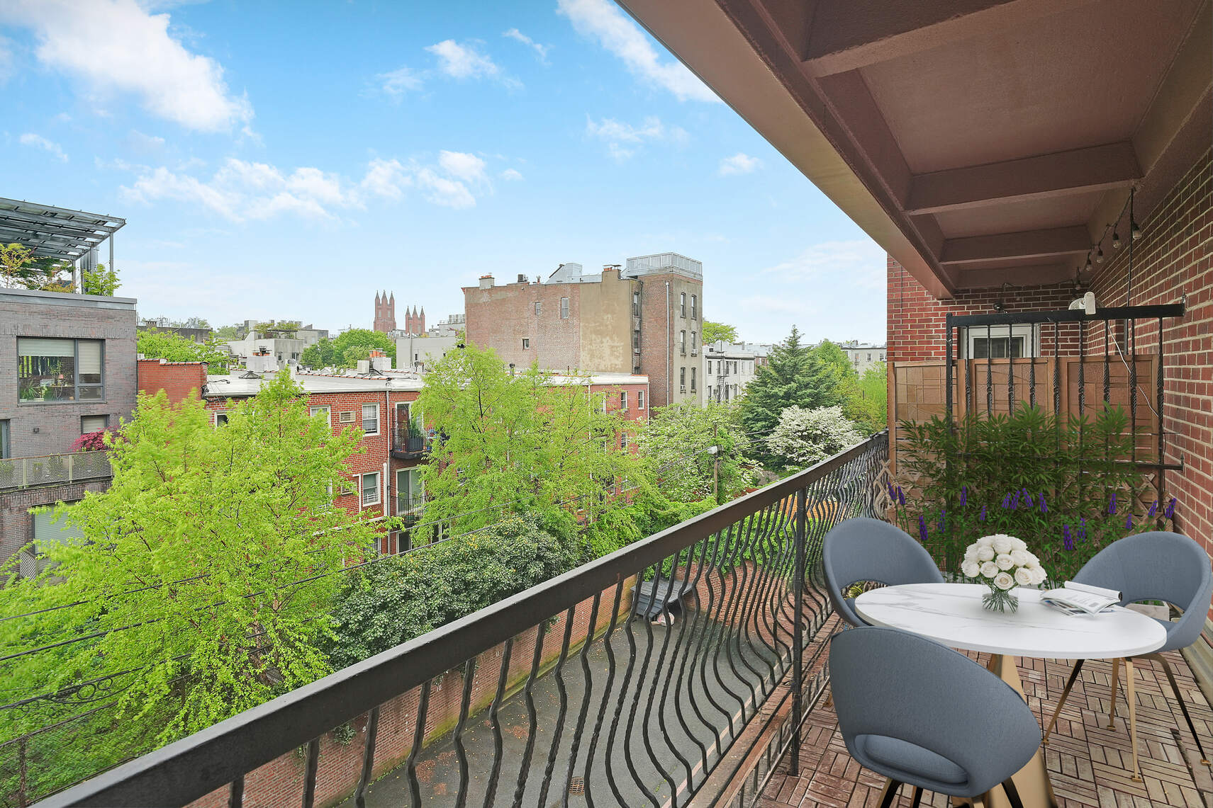 a balcony with an outdoor seating