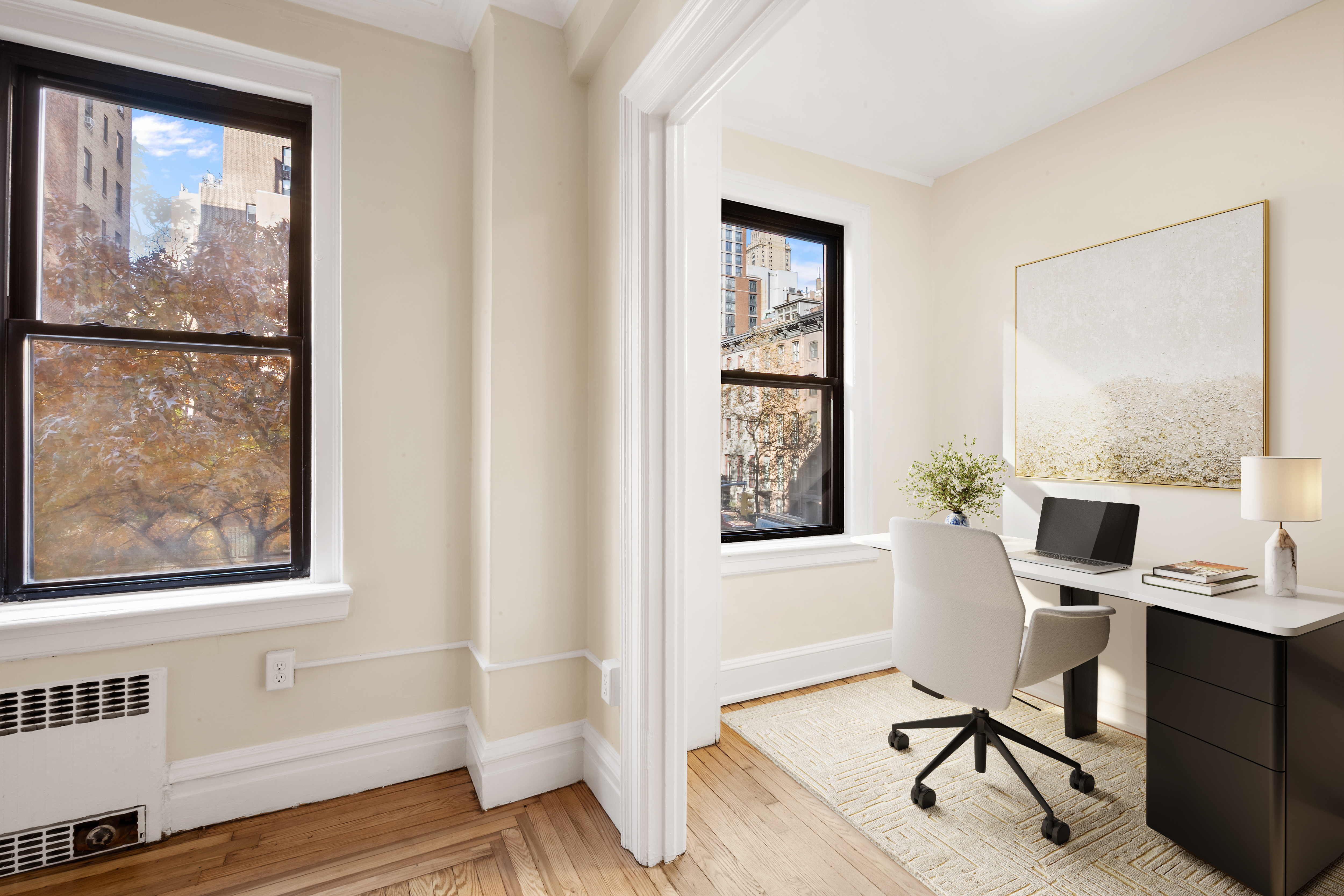 136 East 36th Street, Unit 3B Manhattan, NY 10016 - Photo 4 of 10 a view of a workspace with furniture and a window