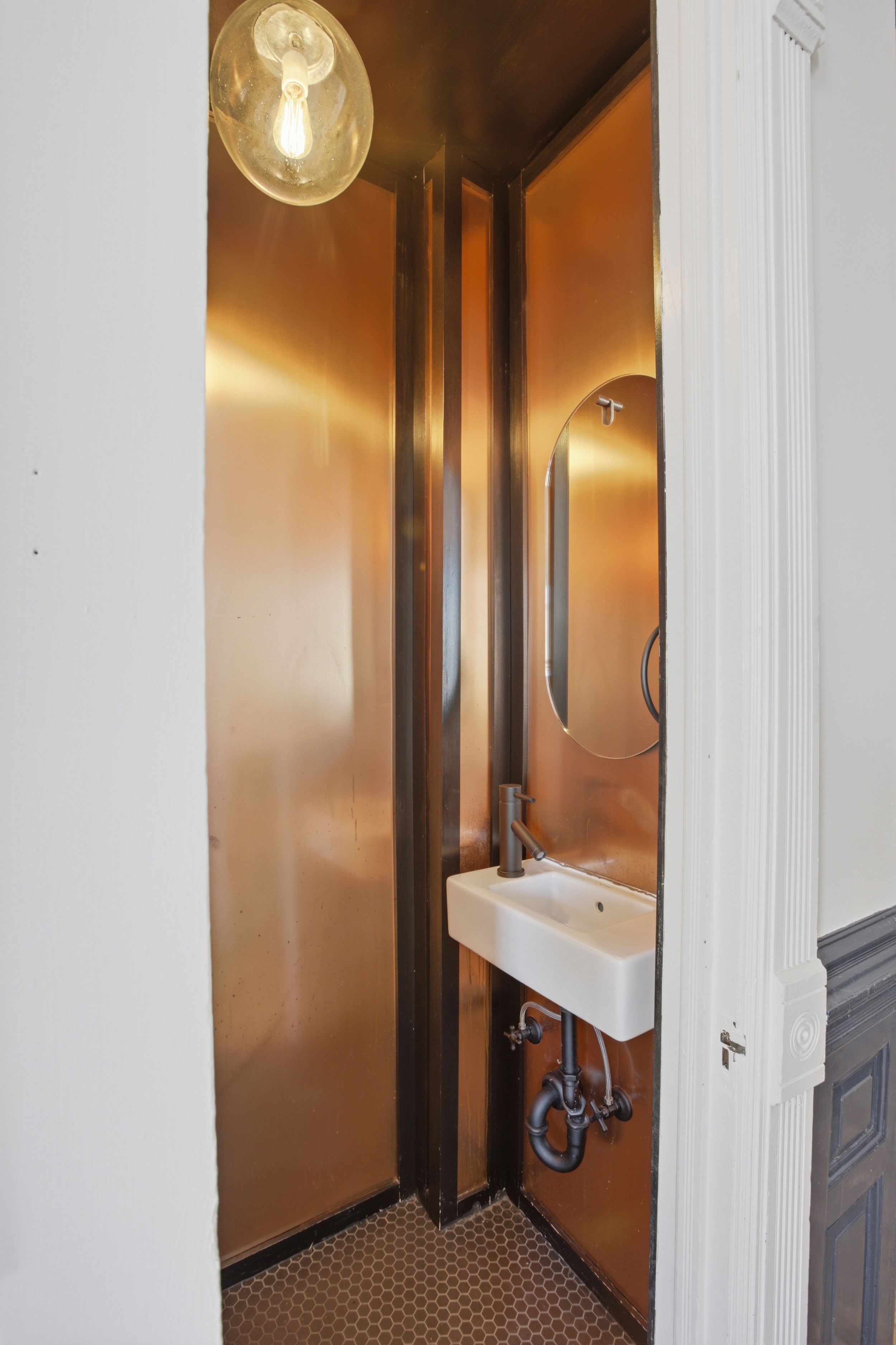 611 Macon Street Brooklyn, NY 11233 - Photo 5 of 15 a bathroom with double vanity and a mirror