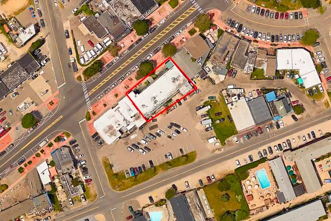 a view of building exterior with patio