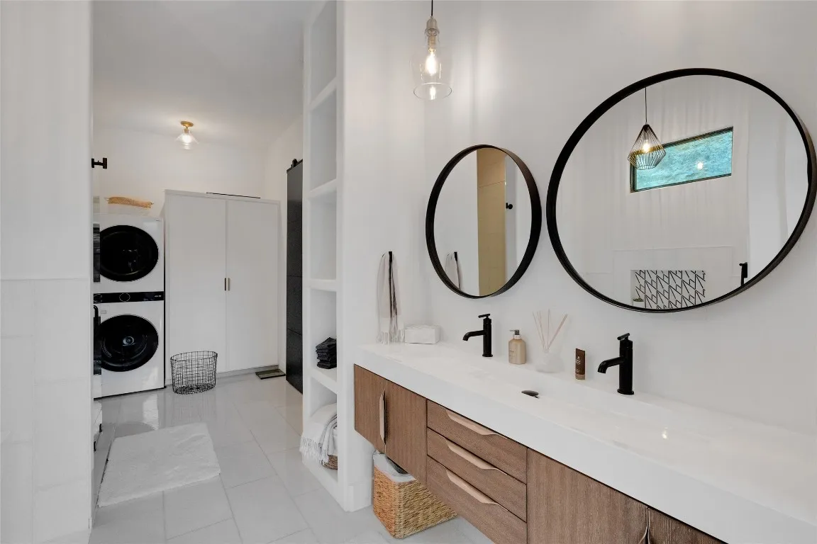 a bedroom with a bed a mirror and a desk