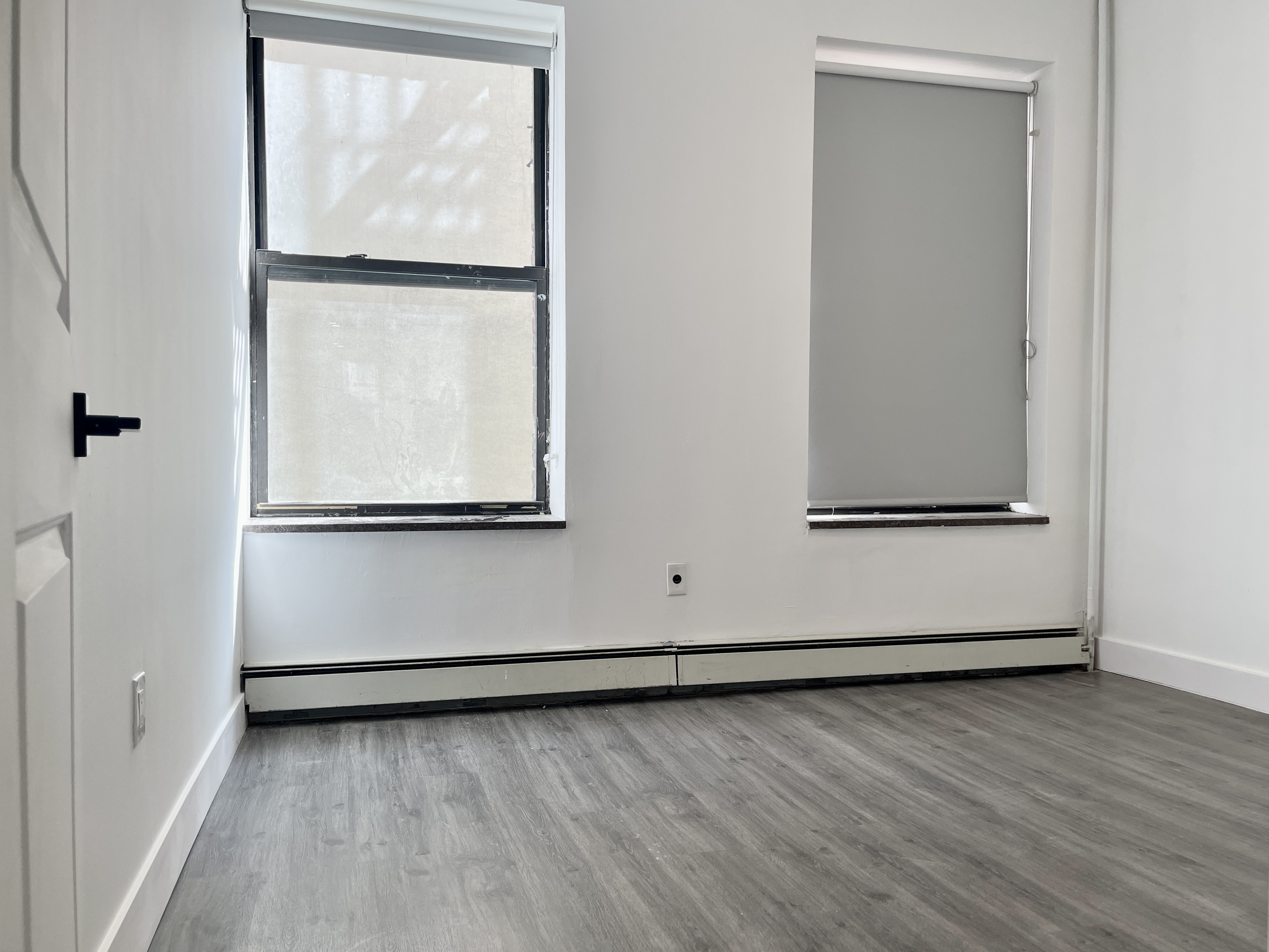 1999 3rd Avenue, Unit 1 Manhattan, NY 10029 - Photo 8 of 23 a view of a small space with wooden floor