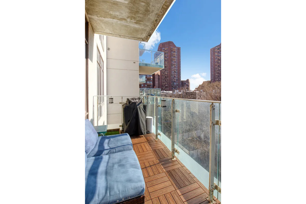 342 East 110th Street, Unit 5E Manhattan, NY 10029 - Photo 3 of 23 a picture of a living room with a rug