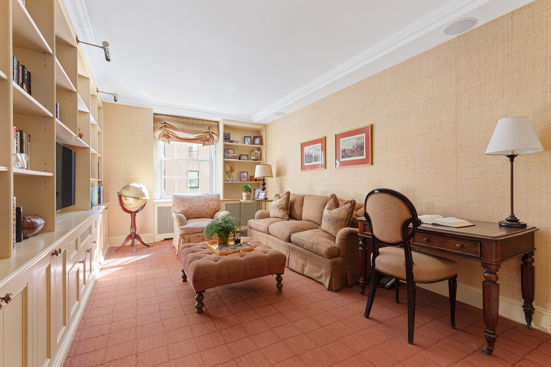 133 East 80th Street, Unit 3A Manhattan, NY 10075 - Photo 5 of 19 a living room with furniture and a flat screen tv