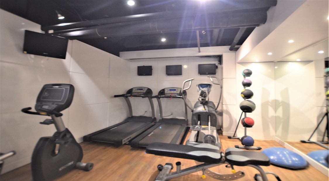 220 East 63rd Street, Unit 4N Manhattan, NY 10065 - Photo 11 of 13 a view of a room with gym equipment