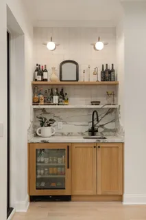 a view of a kitchen with a sink and cabinets
