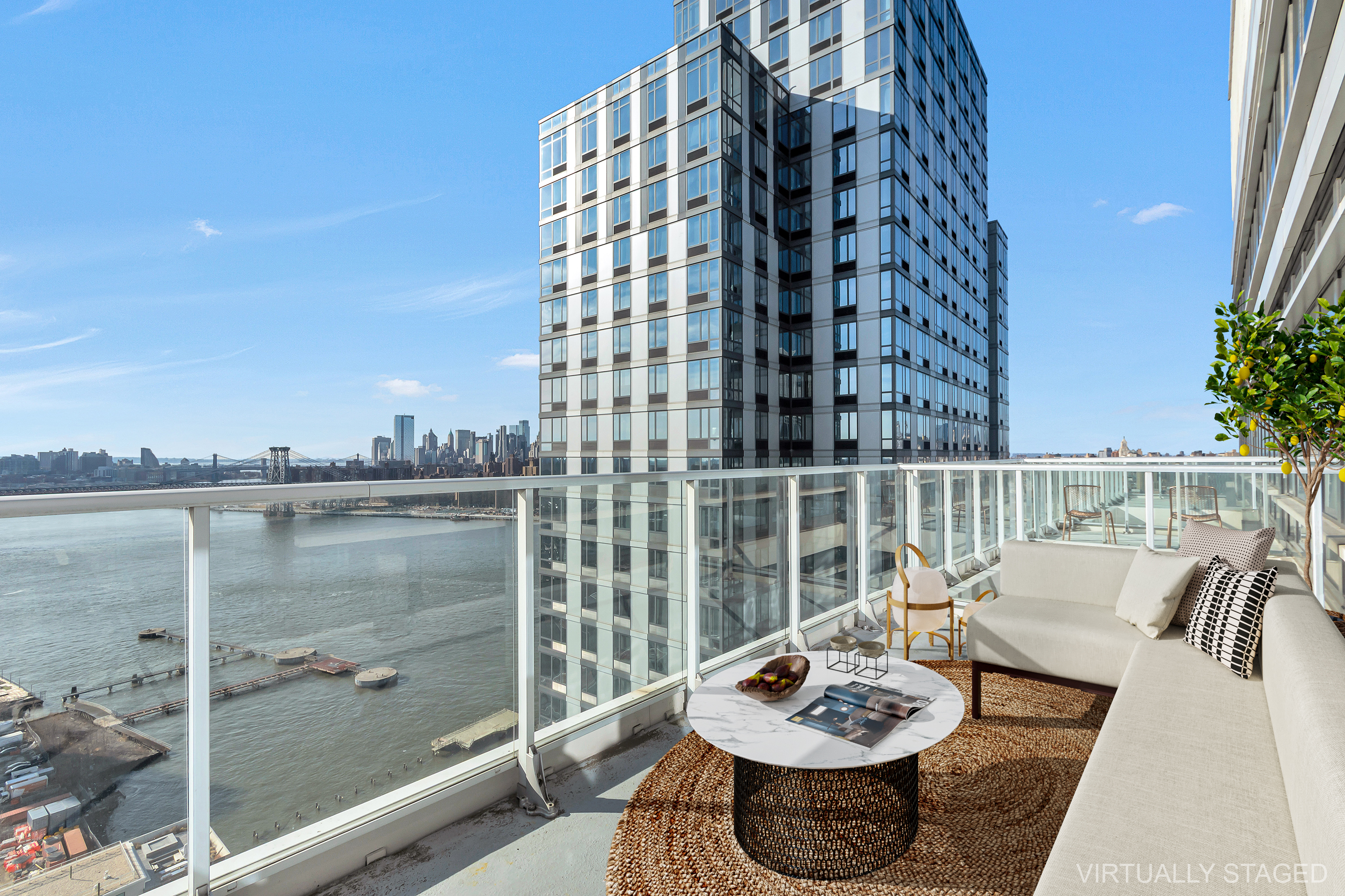 2 Northside Piers, Unit PH2 Brooklyn, NY 11249 - Photo 3 of 27 a view of a balcony with two chairs and a potted plant
