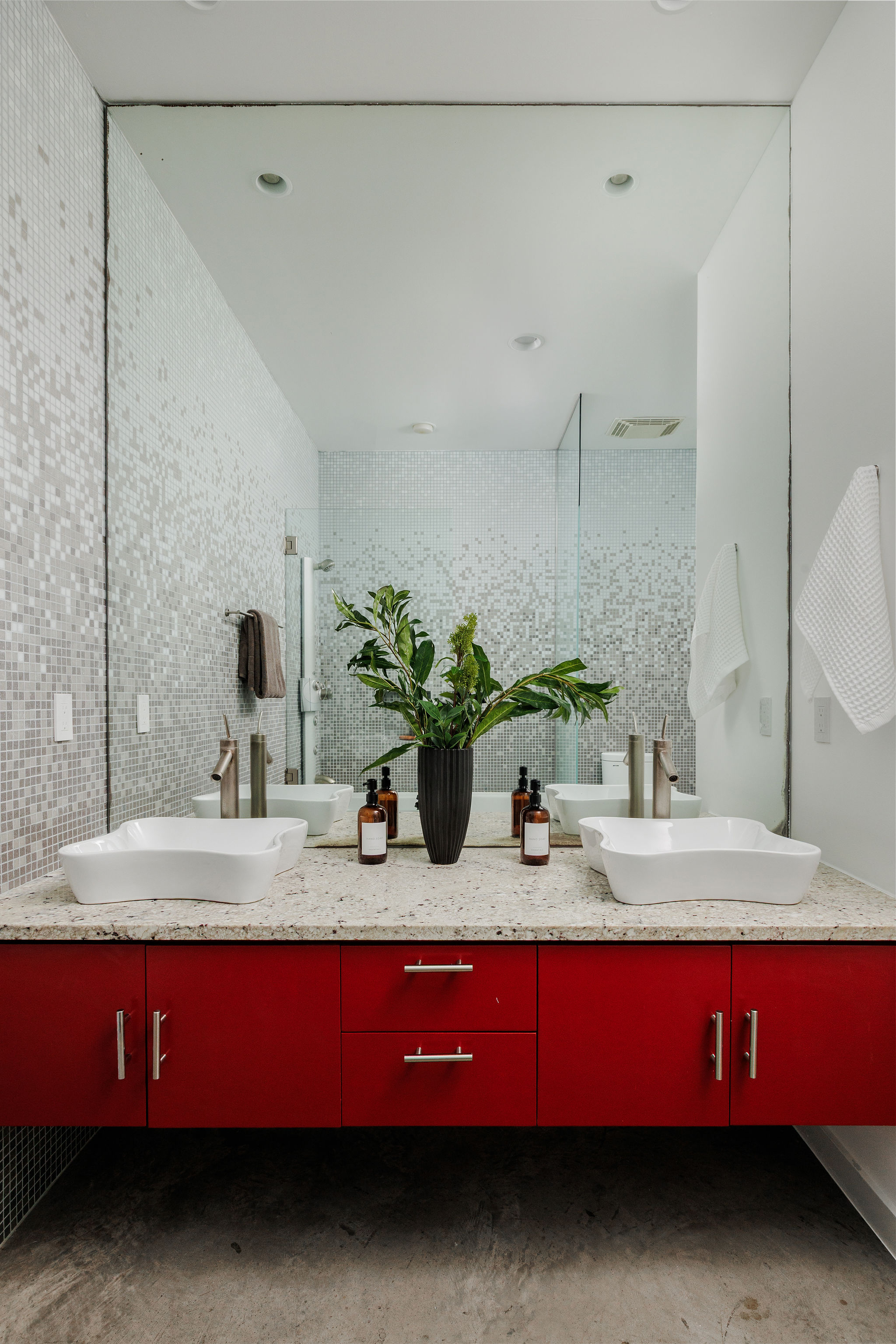1801 Nickerson Street Austin, TX 78704 - Photo 9 of 44 a bathroom with a granite countertop sink a mirror and shower