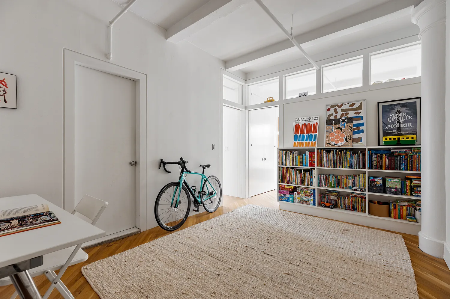 a view of a storage & utility room with closet window