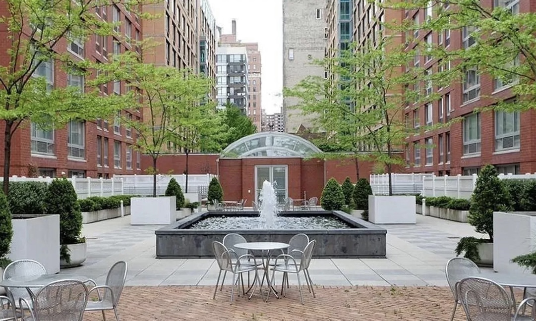 555 West 23rd Street, Unit S14E Manhattan, NY 10011 - Photo 7 of 8 a view of a patio with couches table and chairs and potted plants