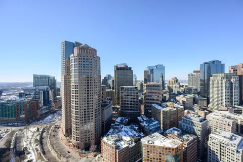 a view of roof deck with two couches and wooden floor