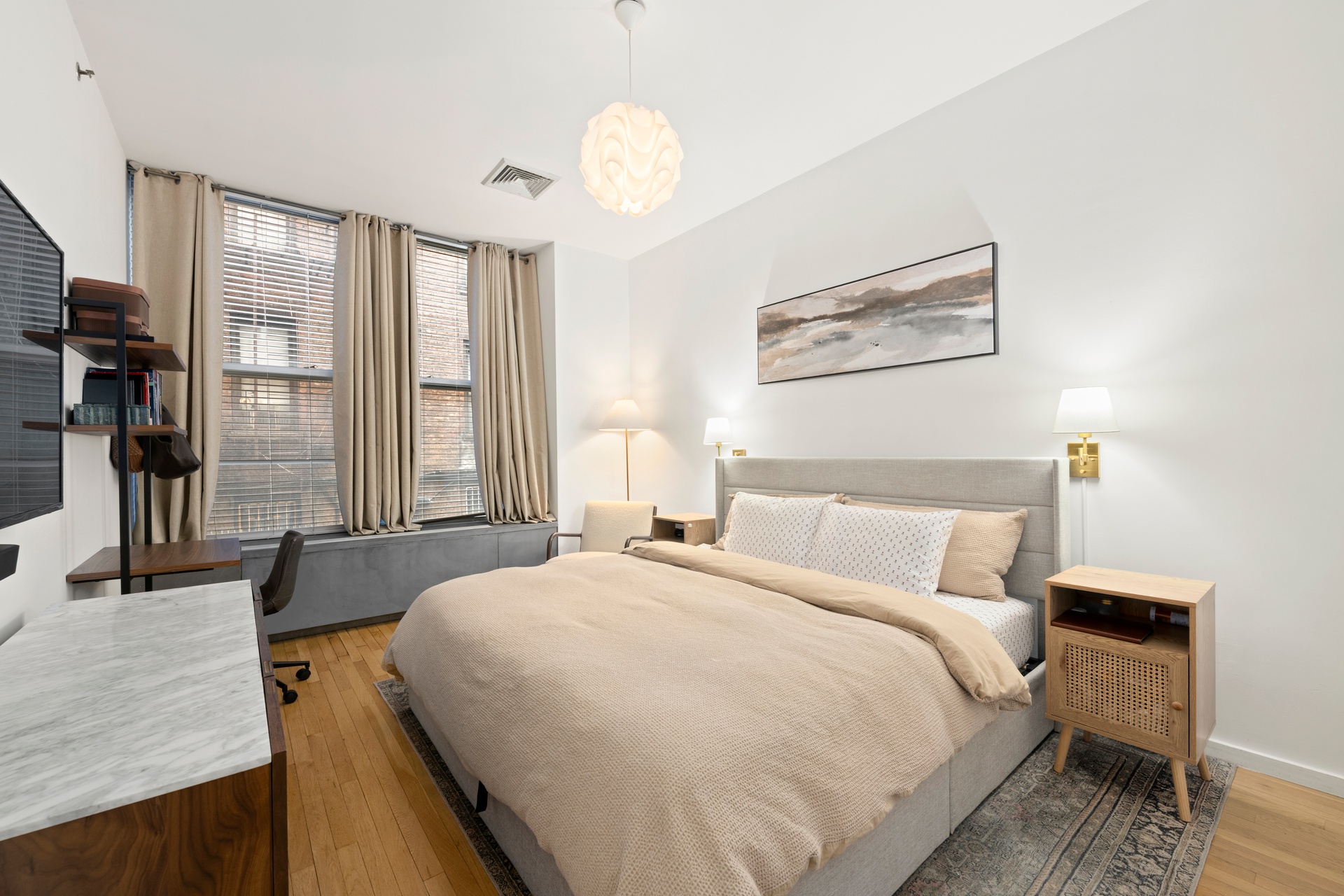 419 West 55th Street, Unit 2D Manhattan, NY 10019 - Photo 5 of 10 a bedroom with bed and window