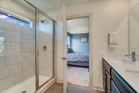 a en suite bathroom with a tub shower and sink